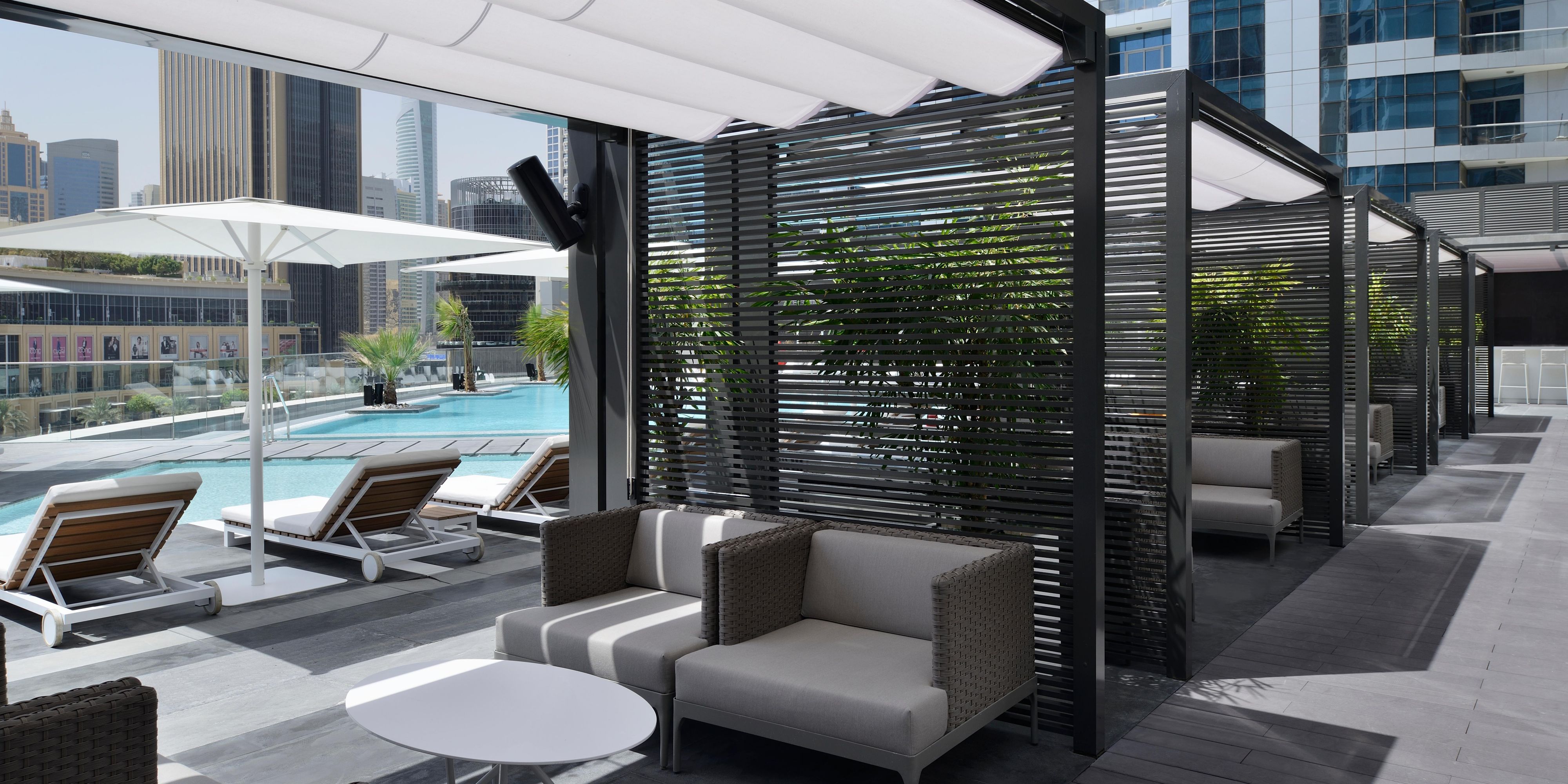 A sleek grey-black palette and violet mood lighting create a chilled-out ambience at our hip pool lounge. Here, you can choose from shisha flavours and a menu of continental sharing plates. Step out onto the roof terrace to sip a chilled drink in your private cabana as the pool sparkles against the spectacular cityscape.  