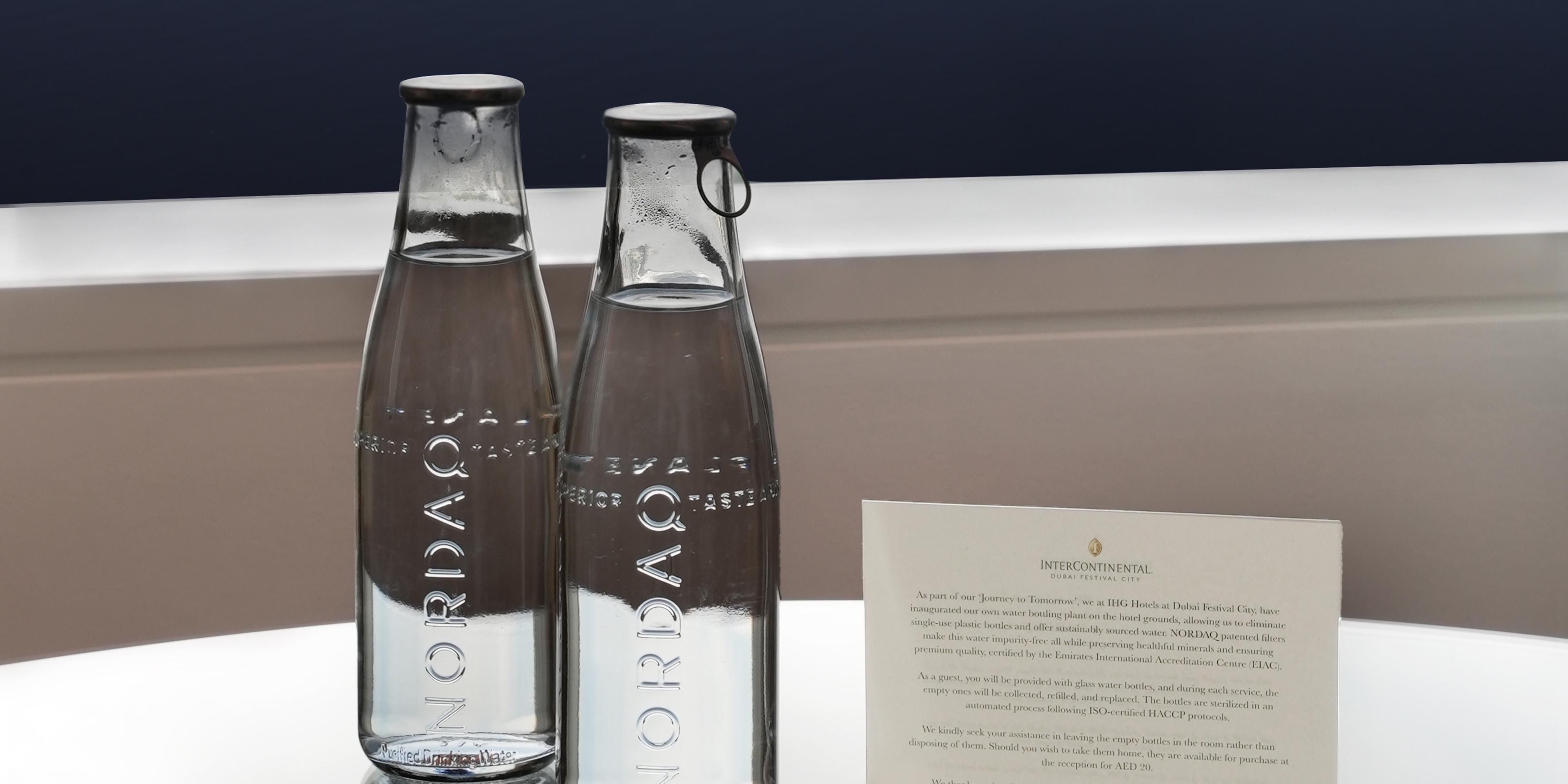 Discover a greener future with every stay at IHG Hotels at Dubai Festival City. Our state-of-the-art NORDAQ glass bottling plant significantly reduces water waste, ensuring a more sustainable environment. We've eliminated single-use plastic bottles in favour of reusable glass bottles, providing an elegant and eco-friendly solution for our guests.