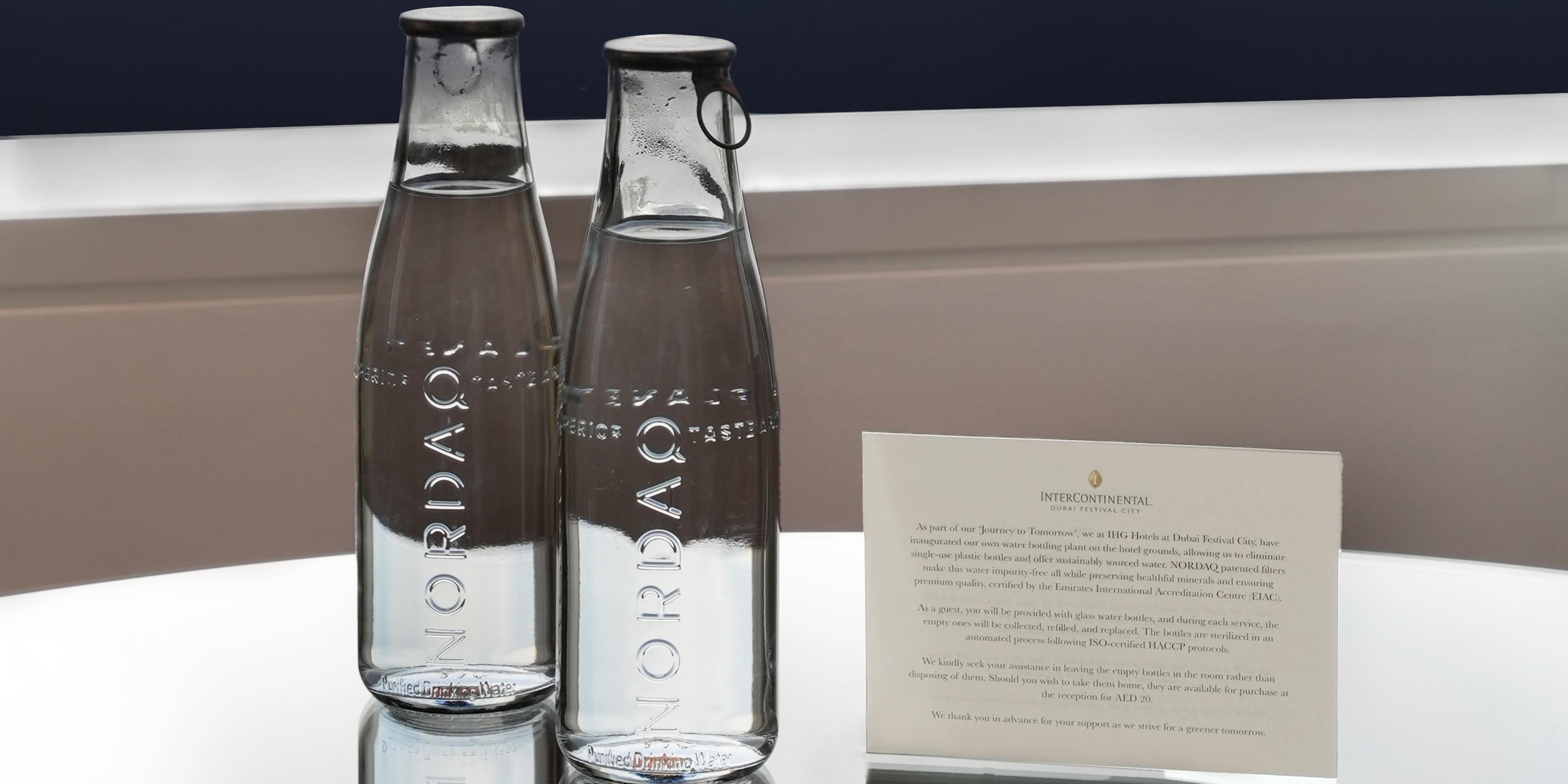 Discover a greener future with every stay at IHG Hotels at Dubai Festival City. Our state-of-the-art NORDAQ glass bottling plant significantly reduces water waste, ensuring a more sustainable environment. We've eliminated single-use plastic bottles in favour of reusable glass bottles, providing an elegant and eco-friendly solution for our guests.