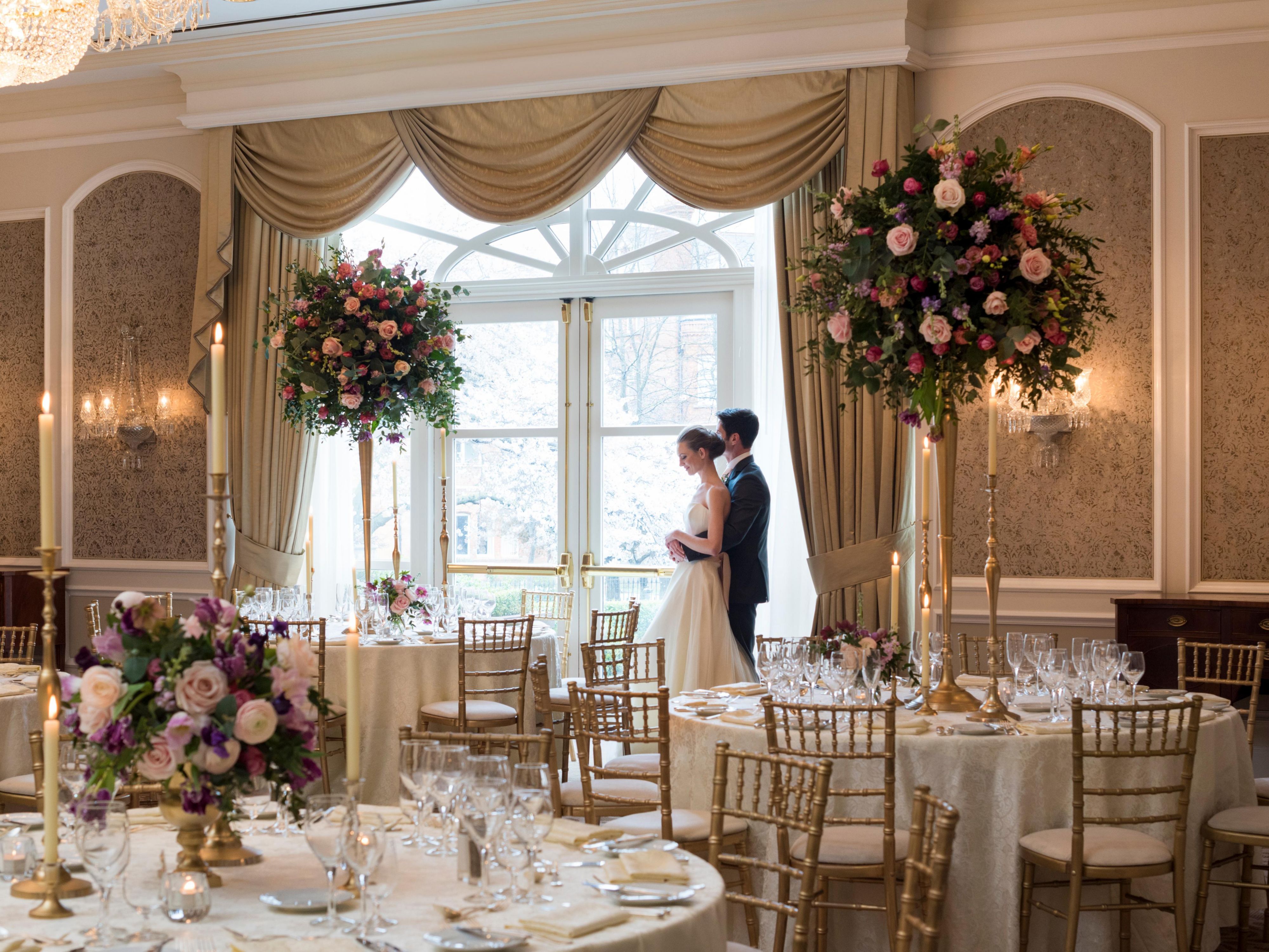 Bride and groom in a large banquet room