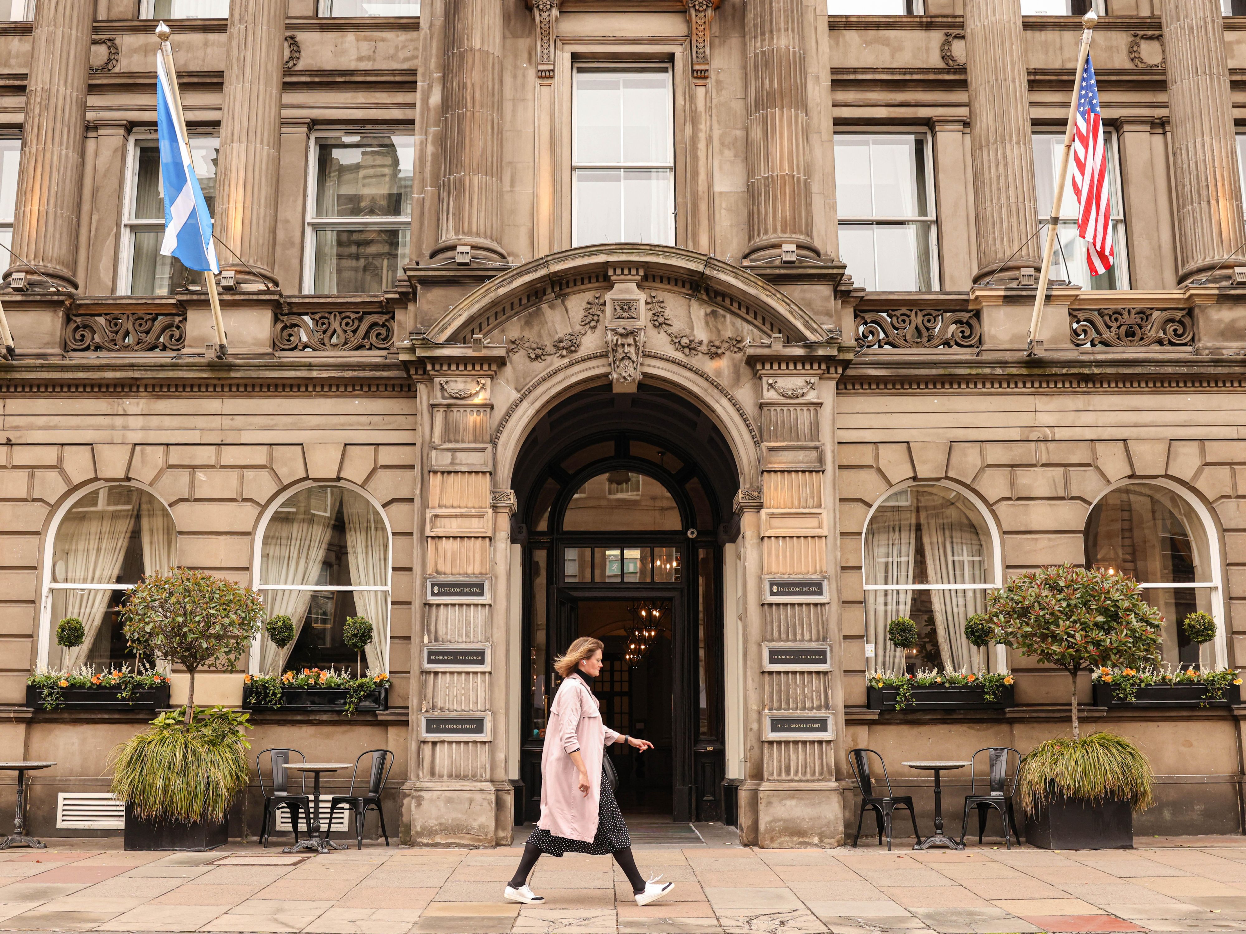 Individual walking outside of InterContinental Edinburgh The George