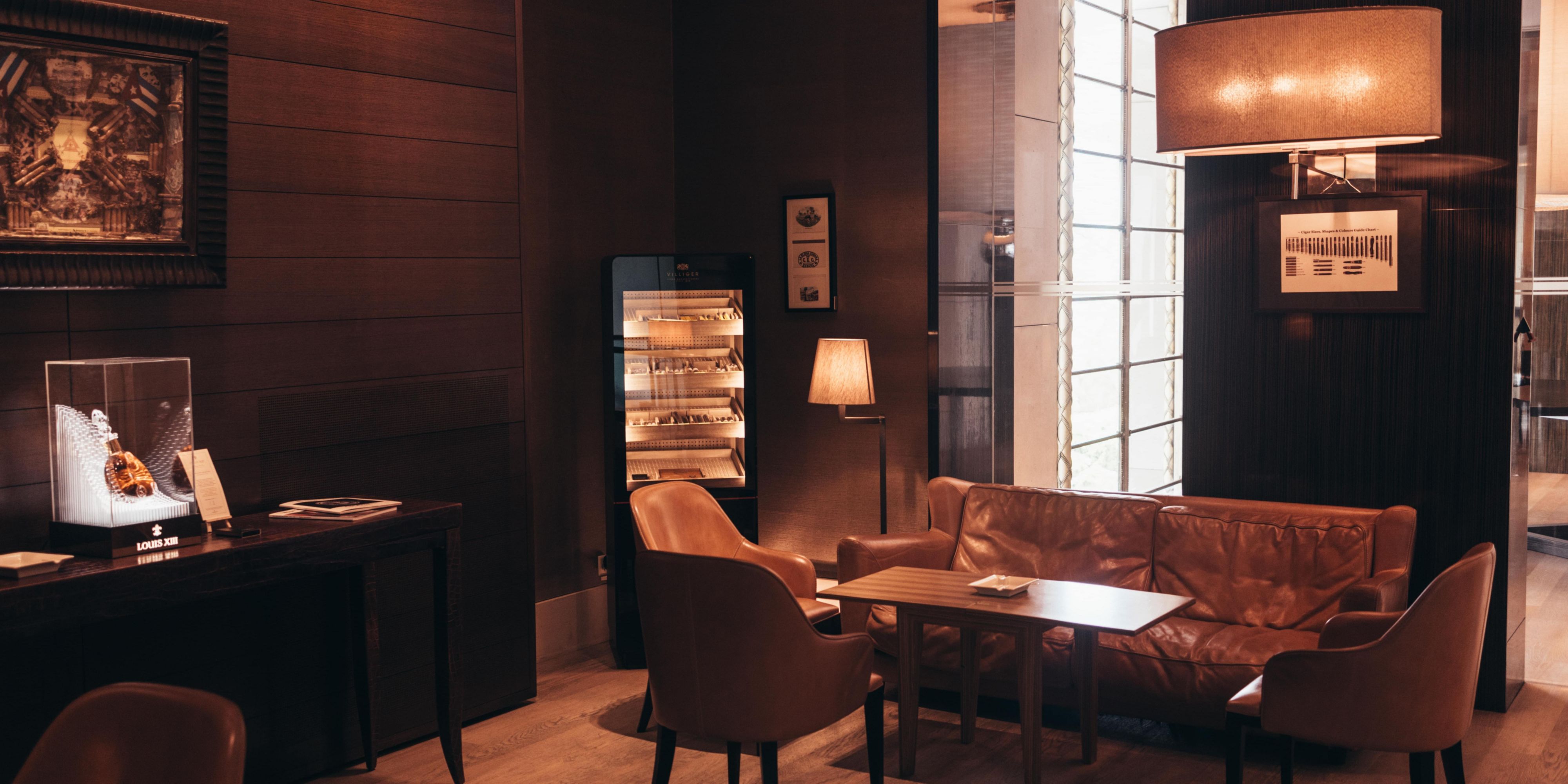 Experience refined relaxation at our Cigar Lounge, designed by Tony Chi. Open daily from 8am to 12:30am, it welcomes both guests and visitors. Immerse yourself in a warm, inviting atmosphere, perfect for cigar aficionados. Enjoy an intimate setting enriched with unique features and a diverse cigar selection.