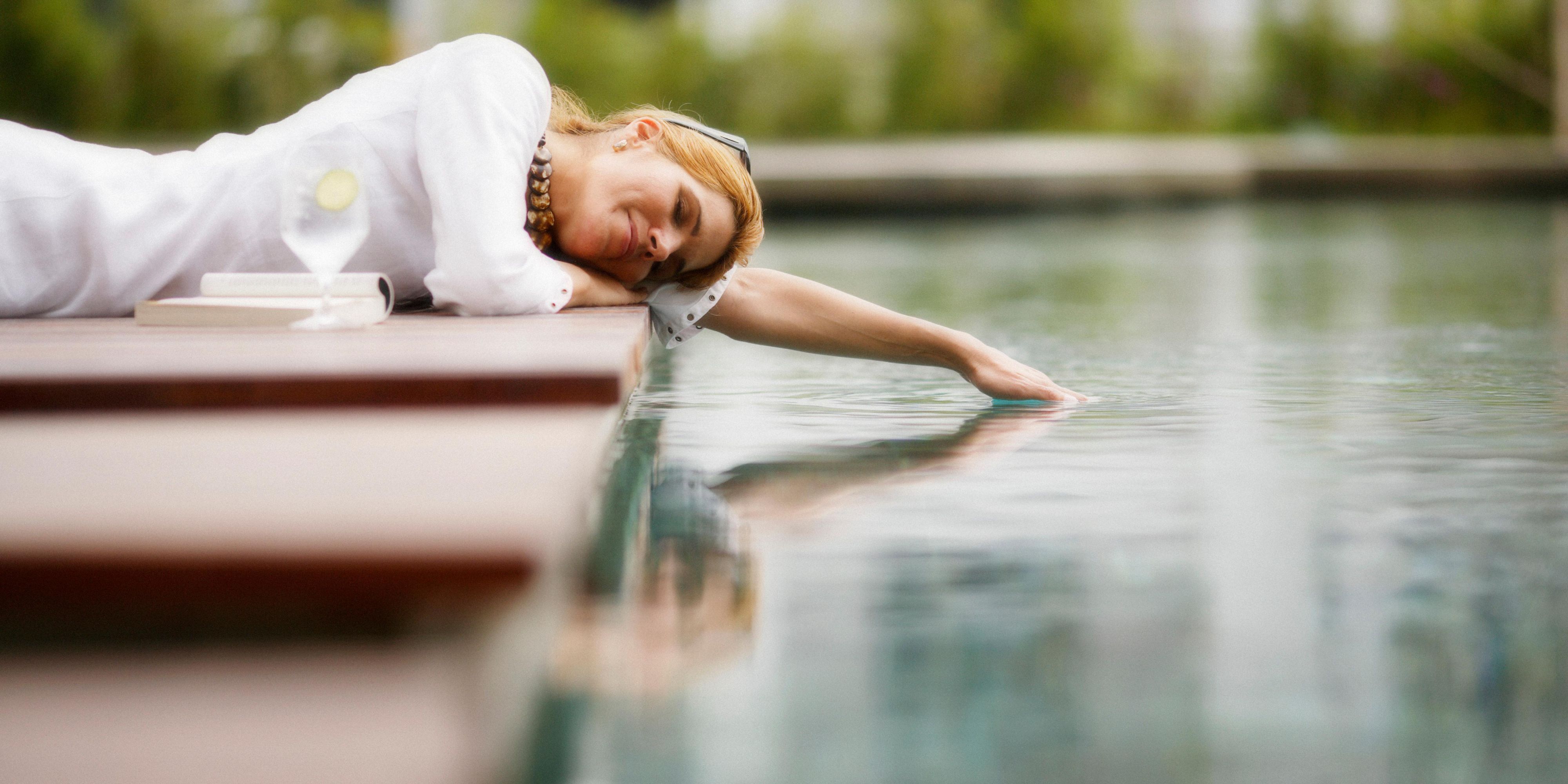 Professional personalised poolside service and arrangement of refreshing beverages and scrumptious food.