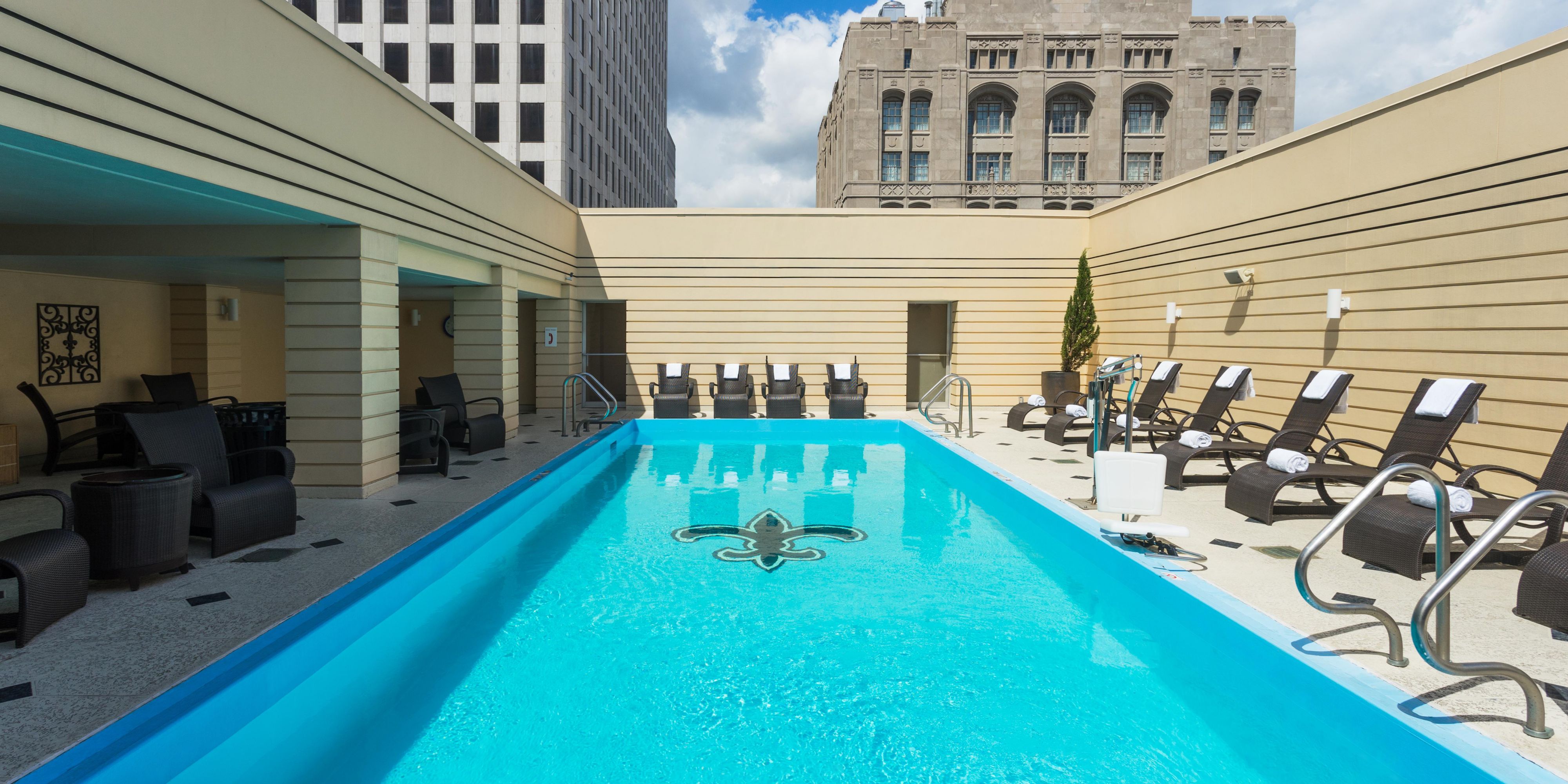 Soak under the sun at our outdoor hotel pool in New Orleans 