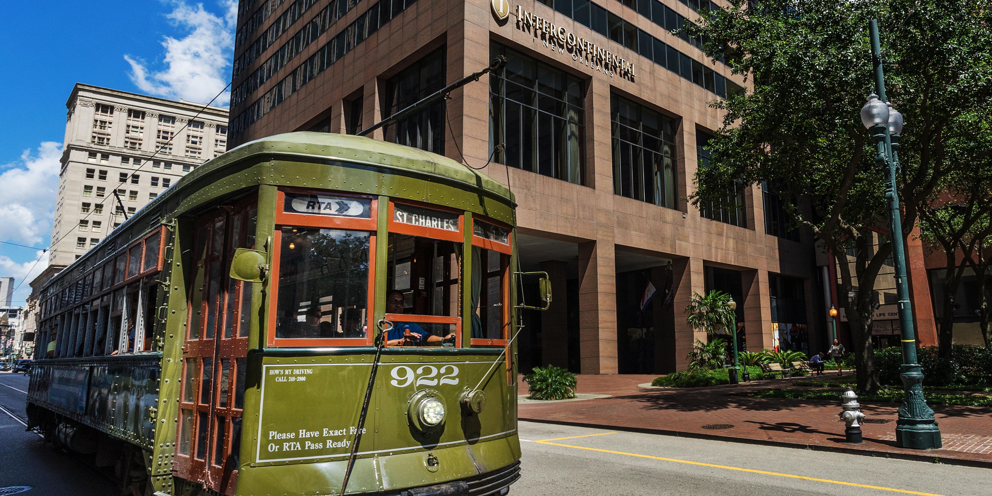 Exterior of the InterContinental New Orleans hotel with streetcar