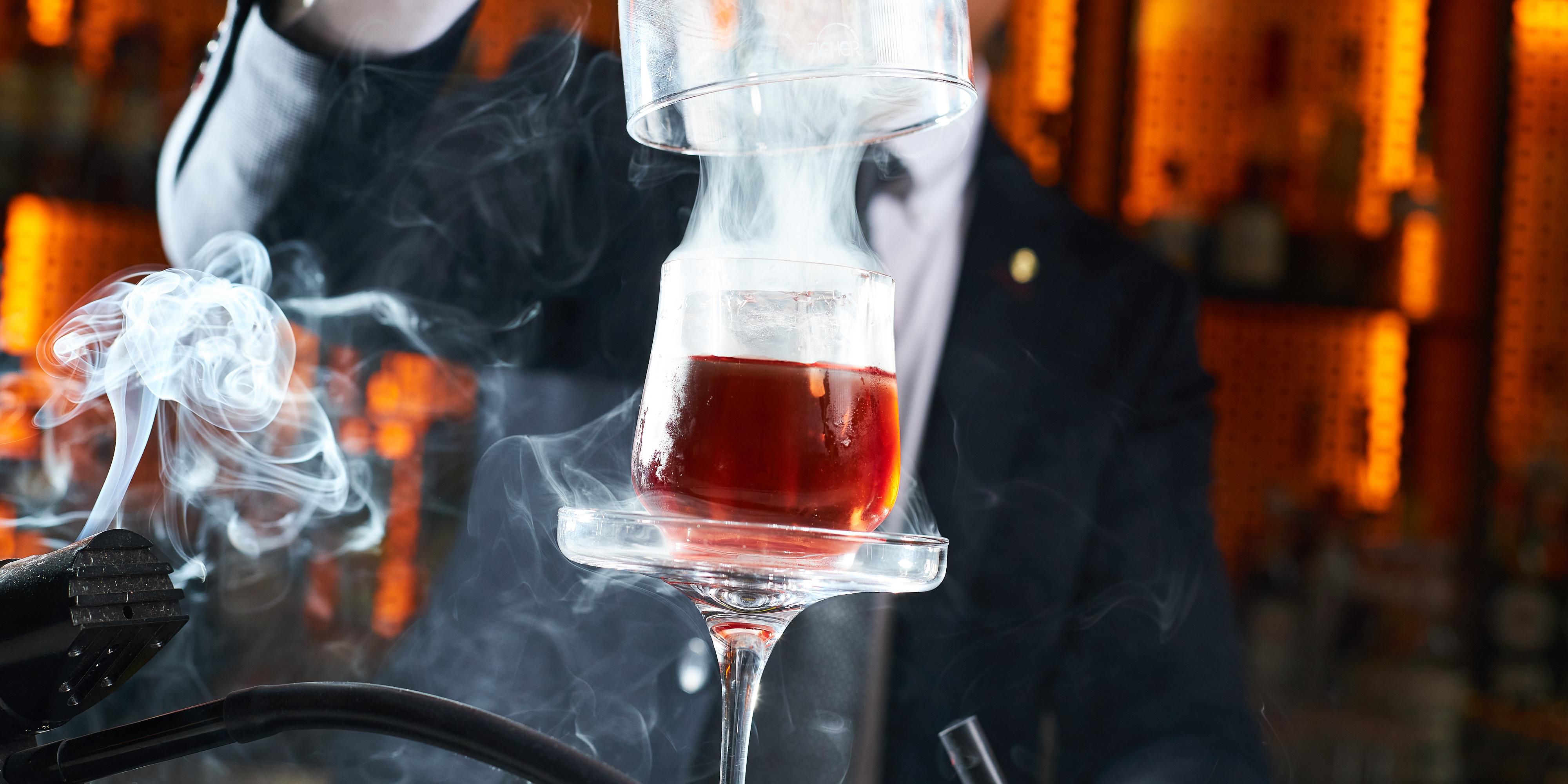 Brass-oni  a voyage of global elegance: premium gin, Campari, Martini Riserva Rubino, and Amaro Montenegro intertwine with torched cauliflower and sous-vide squash, crafting a sublime intercontinental experience in every exquisite sip.