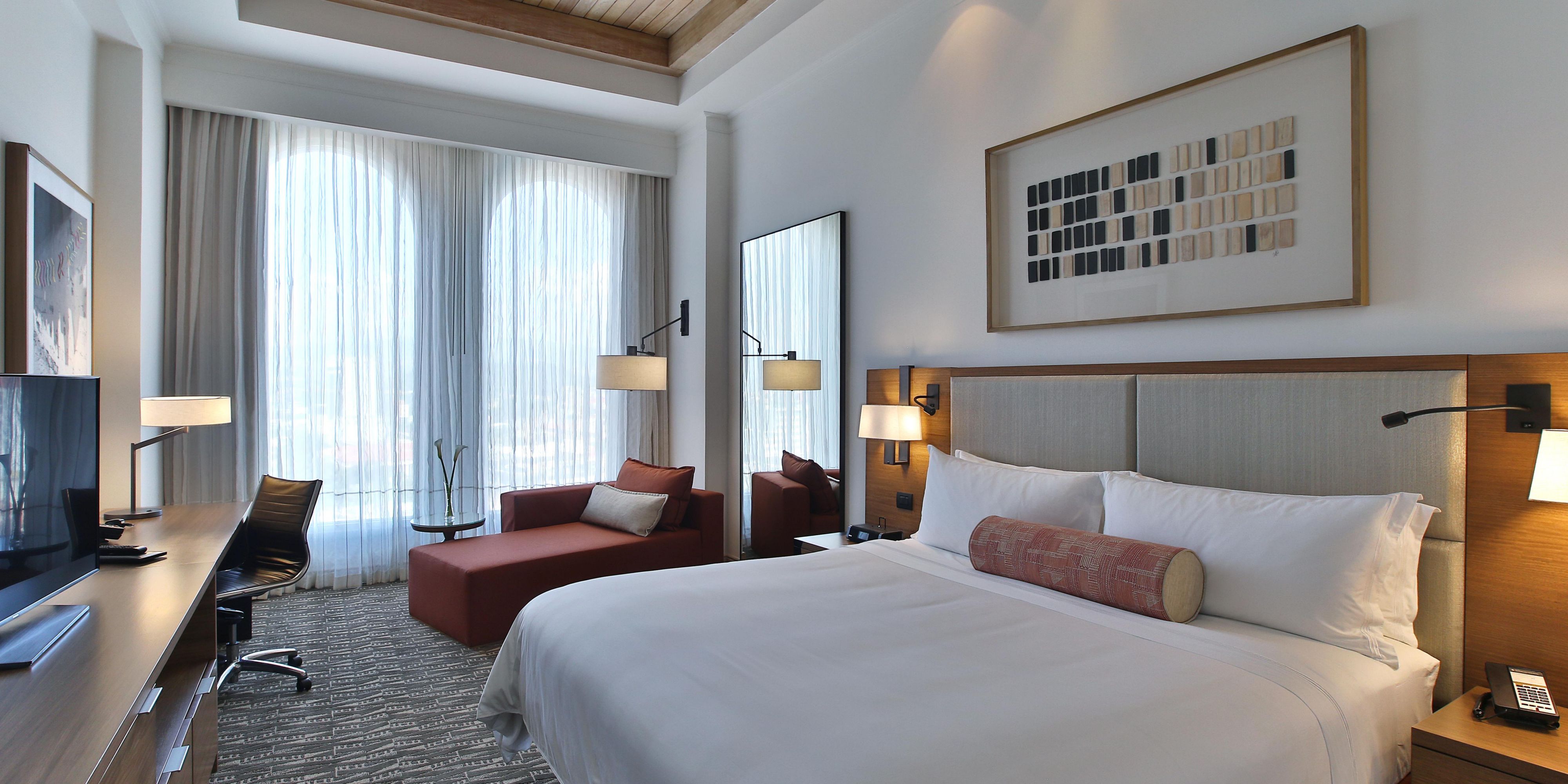 Relax in your spacious room with space for working and lounging.