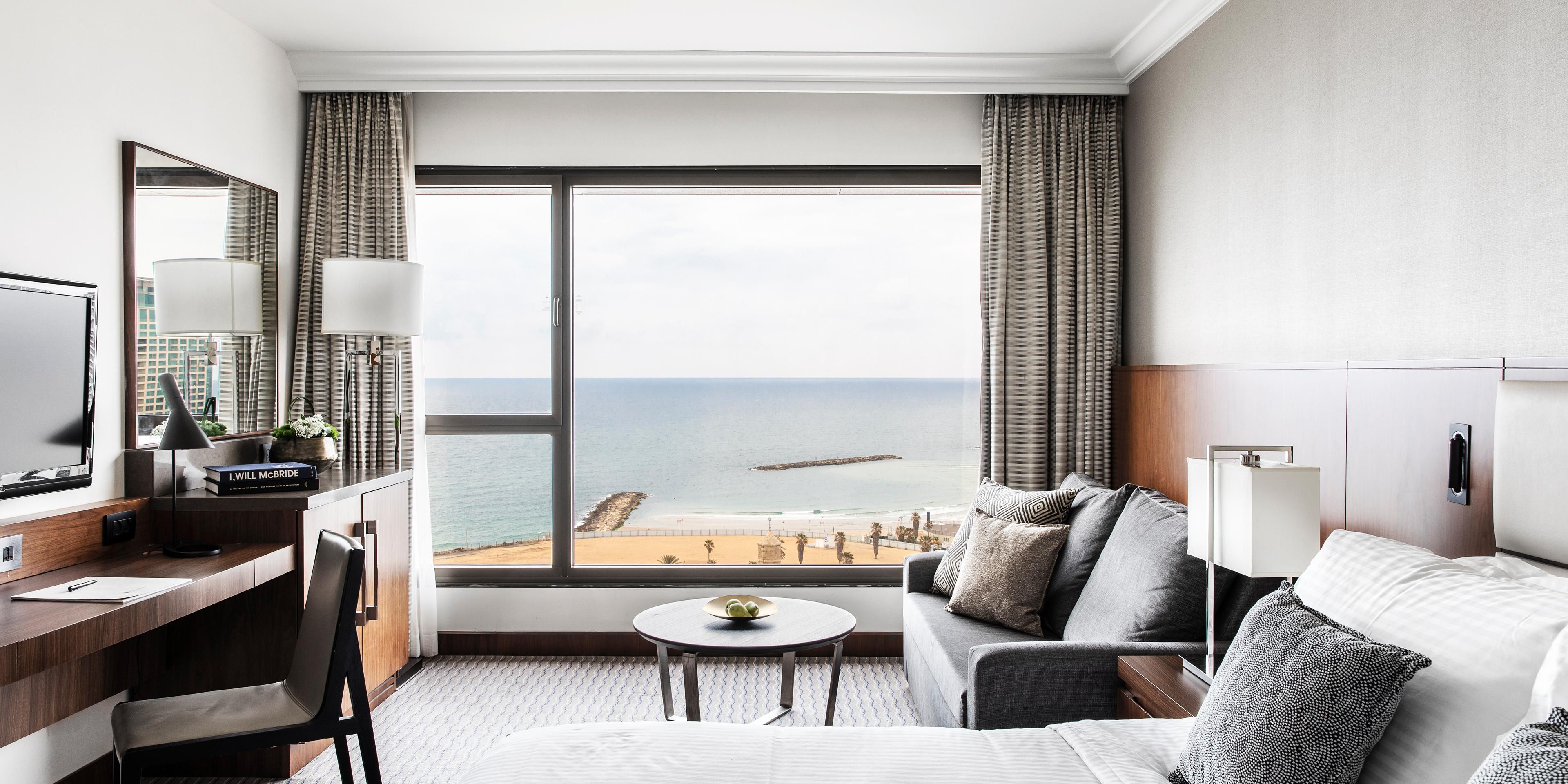 More than 90% of our rooms feature breathtaking Mediterranean Sea views, inviting you into a realm of tranquility and connection. Whether enjoying breakfast on your balcony, relaxing by the pool or savoring a drink at the Club Lounge, the ever-present Mediterranean Sea weaves peace and inspiration into every moment.