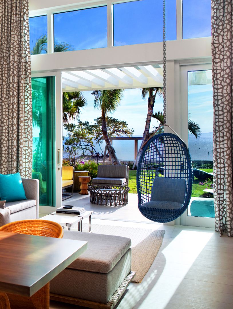 bungalow in grand cayman with colourful decor and stuning views of the ocean