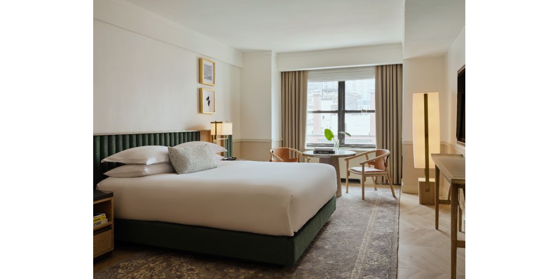 guestroom with luxe furnishings and new york city views