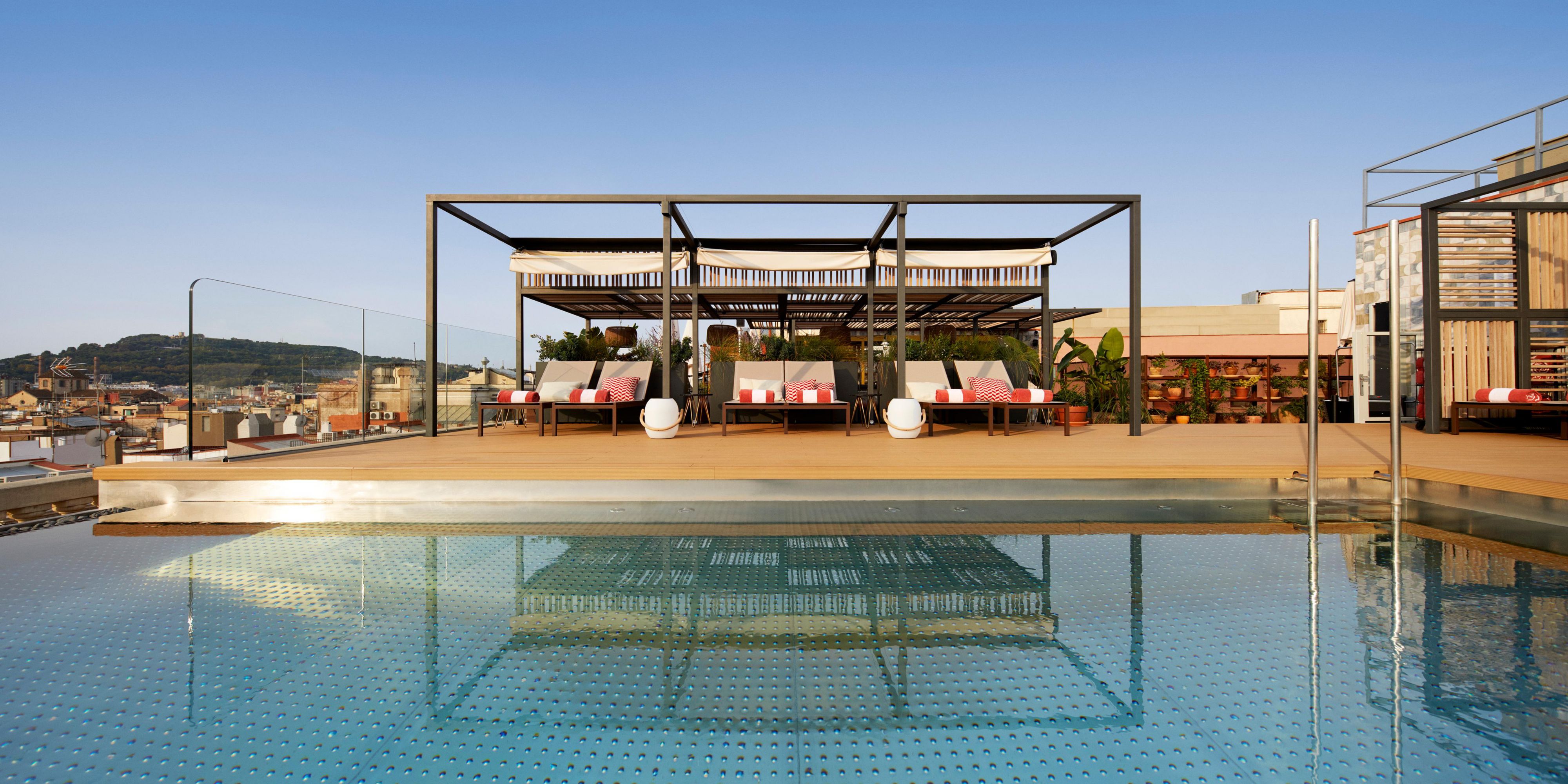 Relax in our rooftop pool with views to Barcelona's Cathedral