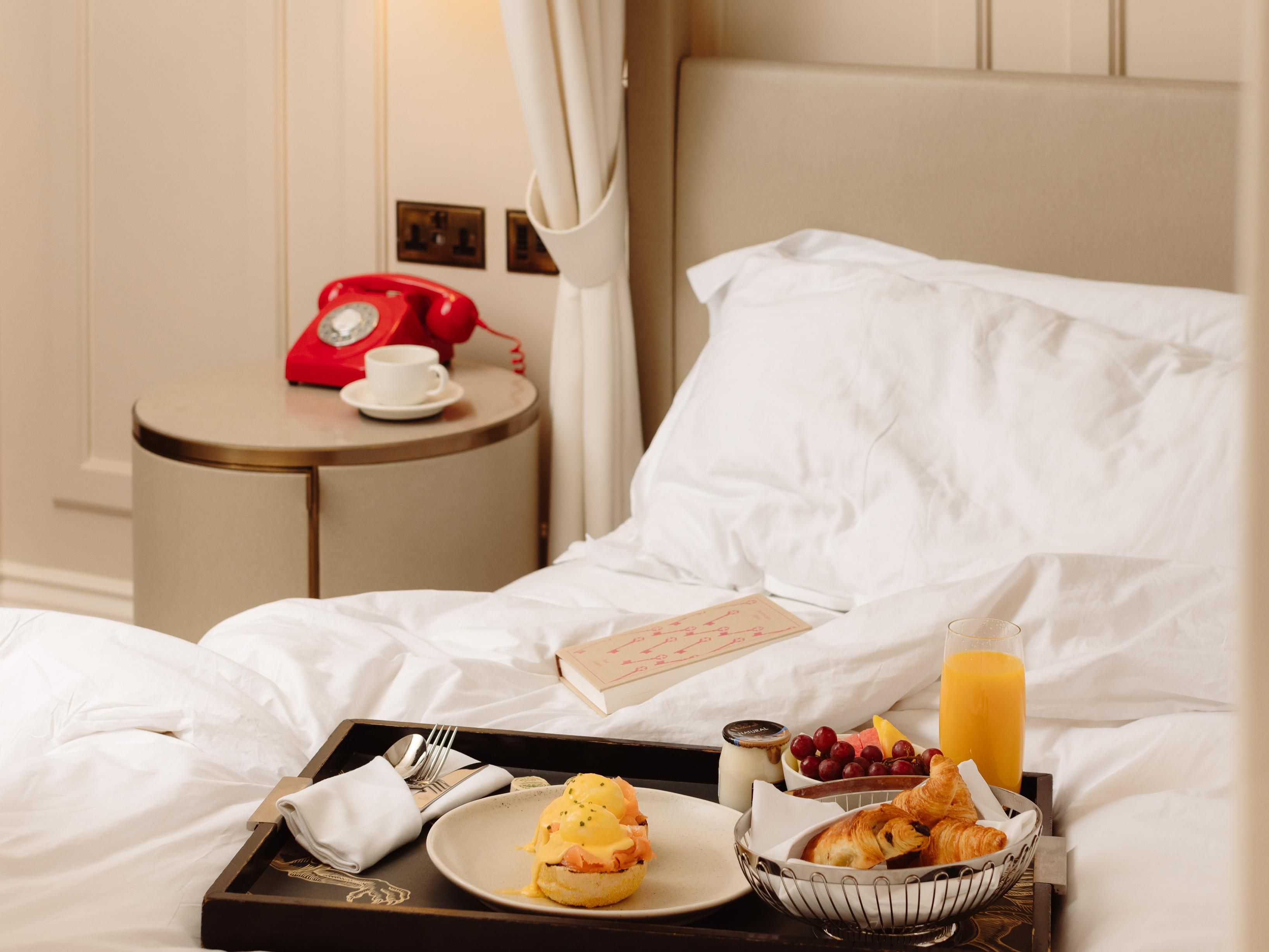 In-Room breakfast plate with eggs benedict and fruit