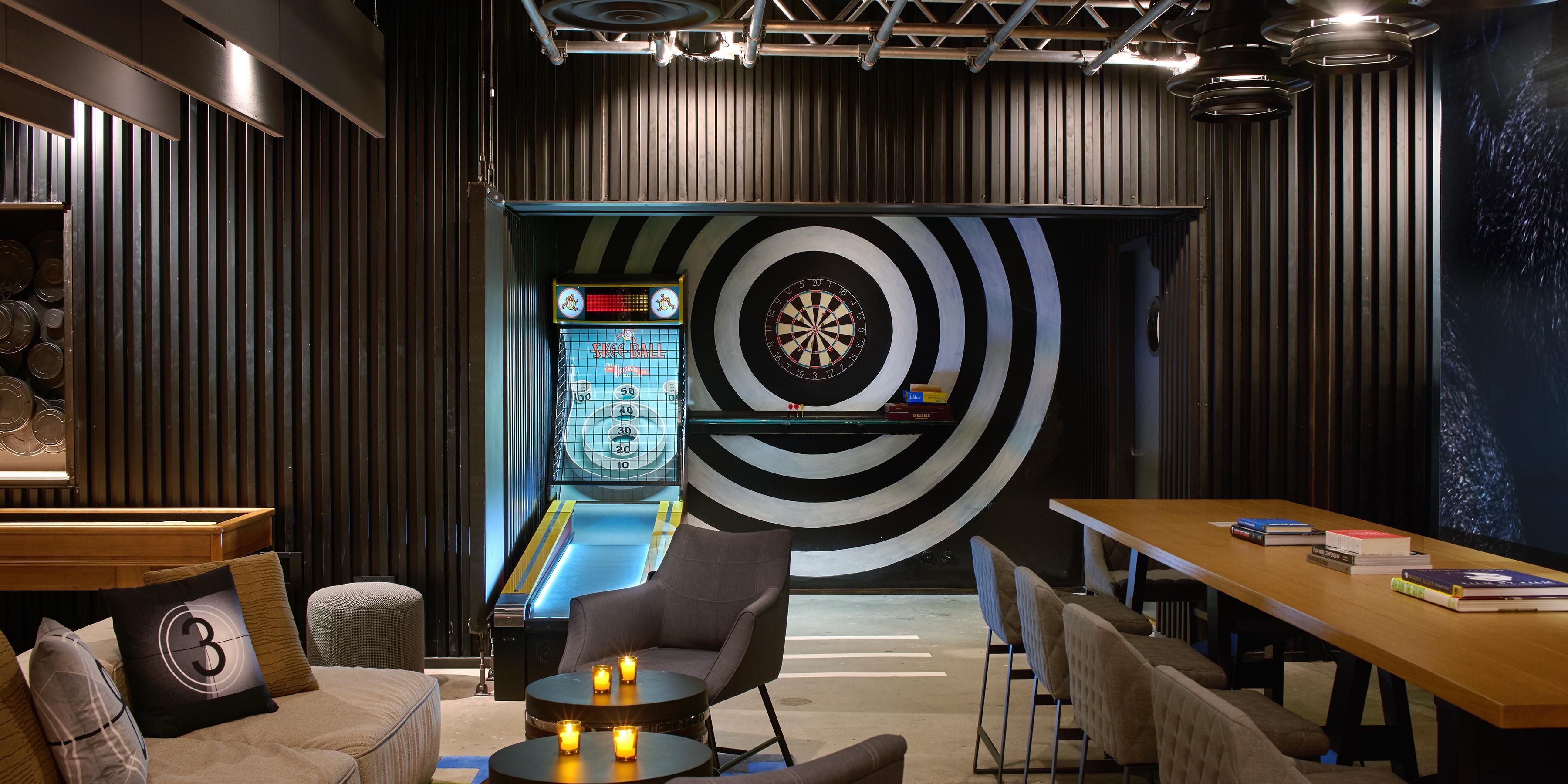 Grab a cocktail and enjoy a round of skee-ball, shuffleboard, pool, darts and more in the slick new game room at our Double Take restaurant. With an edgy aesthetic, it's the perfect spot to unwind or take a break and incorporate some play into your day.