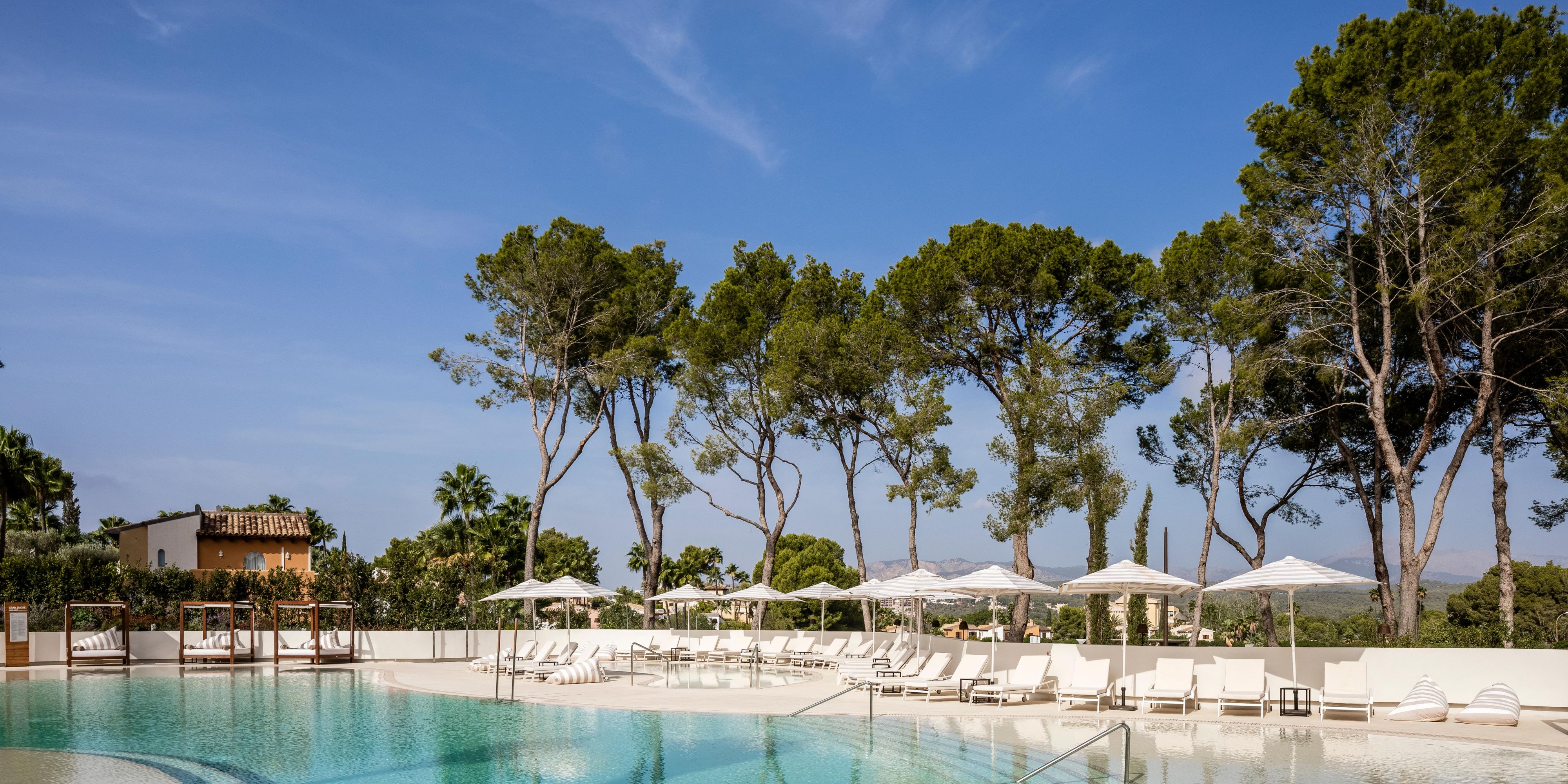 Discover your personal oasis at our hotel within the lush native gardens of Mallorca. Bask in the warm Mediterranean sun and choose from a selection of outdoor pools for a refreshing dip. When you're ready to relax, unwind at our stylish Med Rest and Zayt.