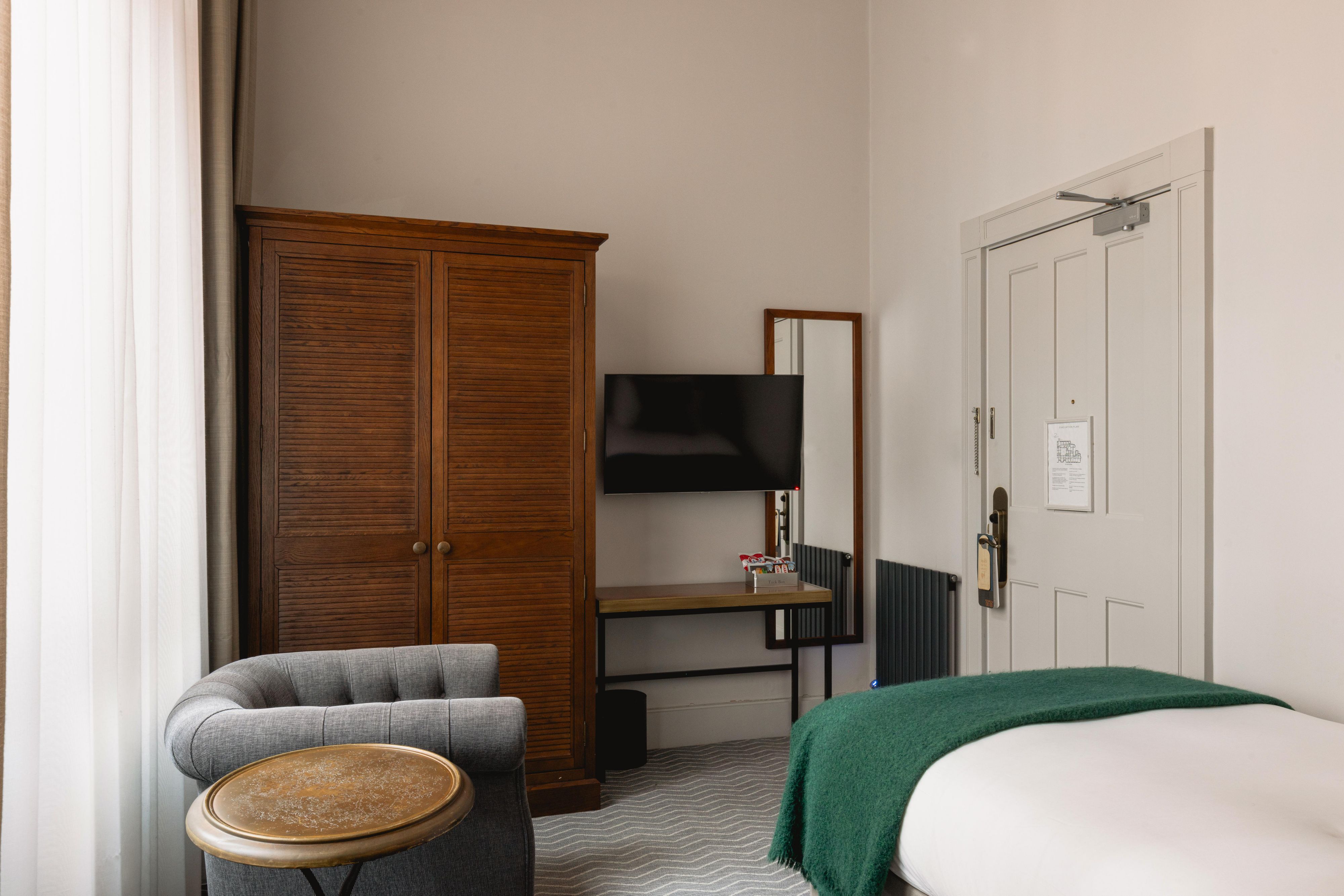 Single hotel guest hotel room storage and television view