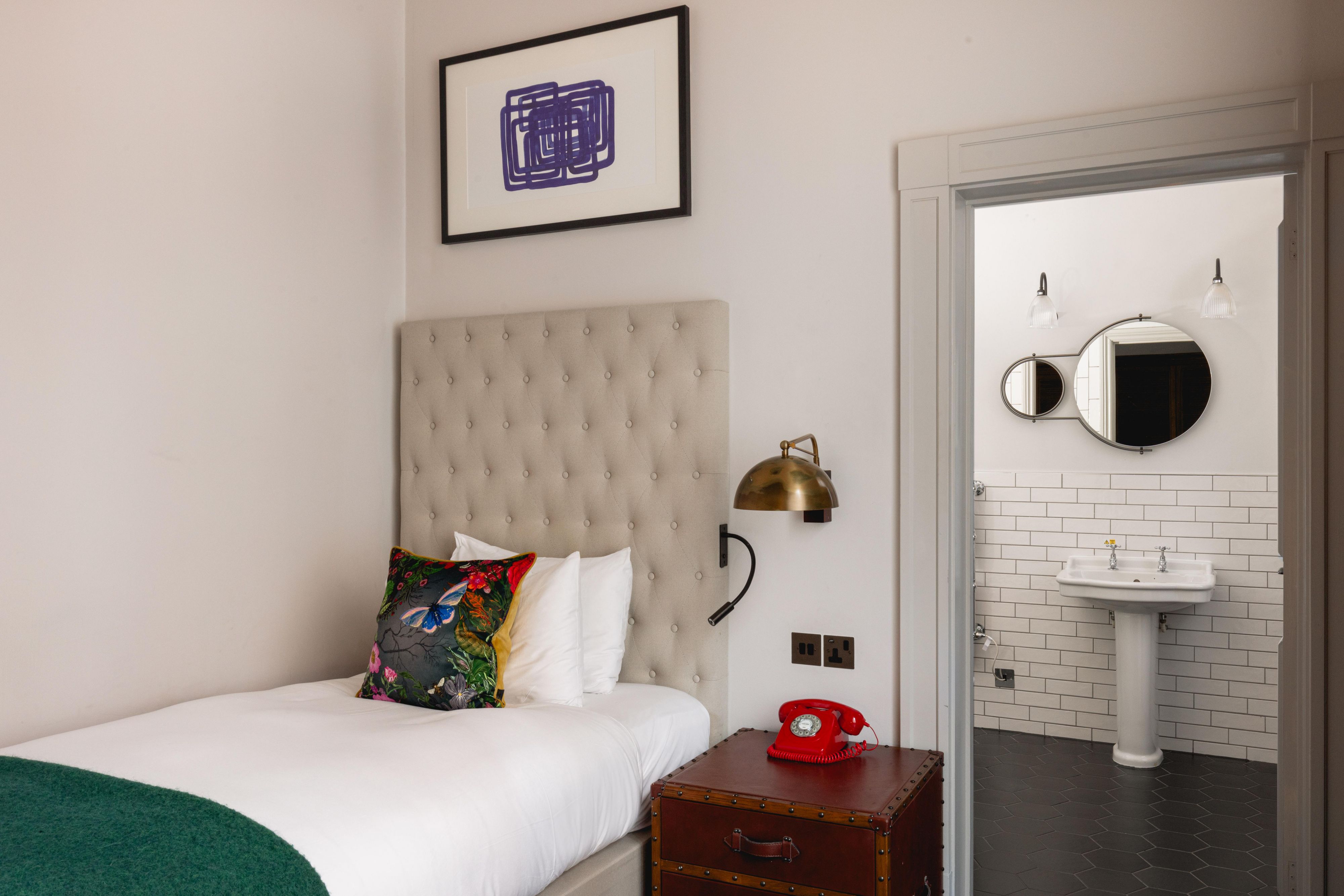 Single hotel guest hotel room with view of en-suite