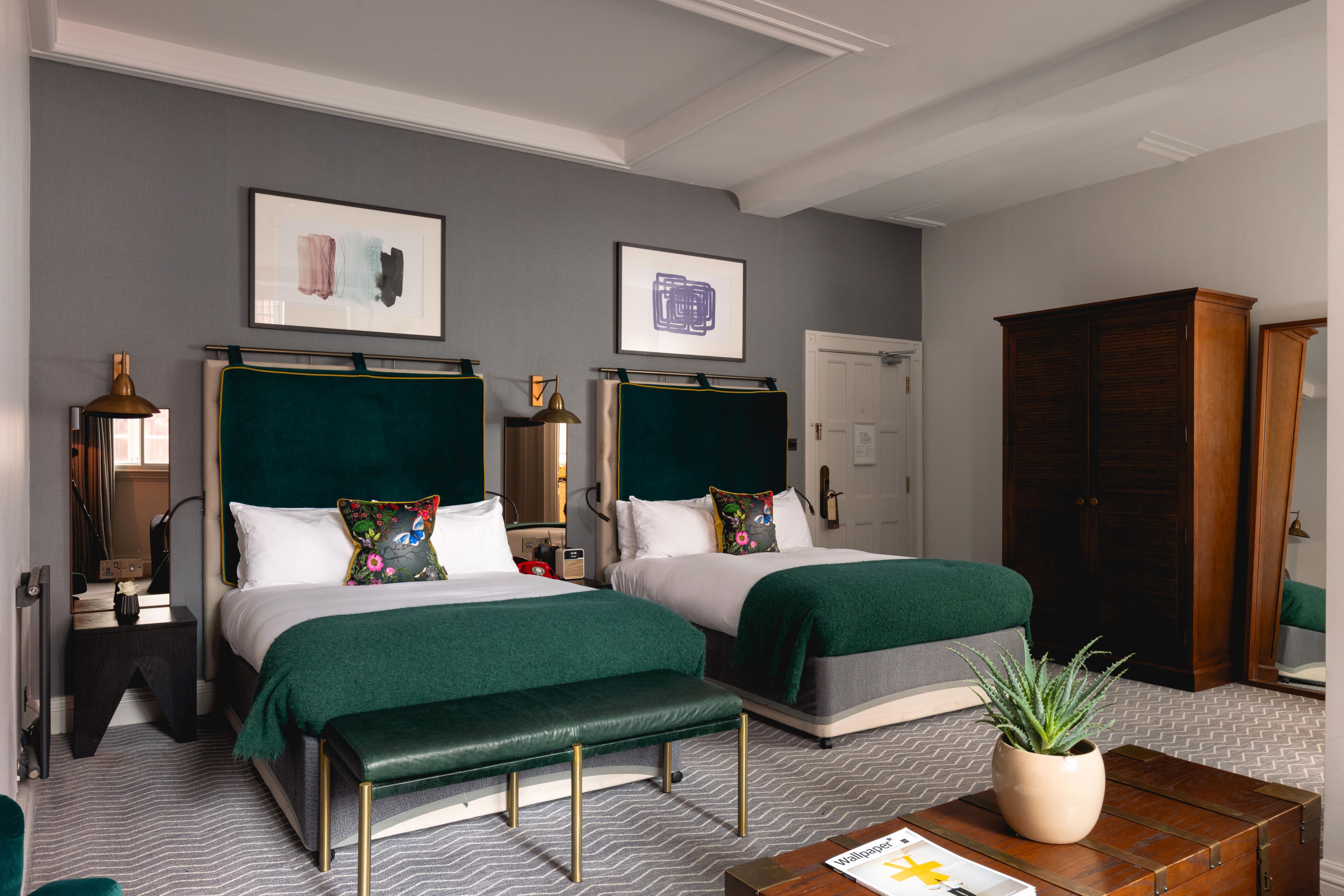 2 king sized beds in a luxury hotel suite