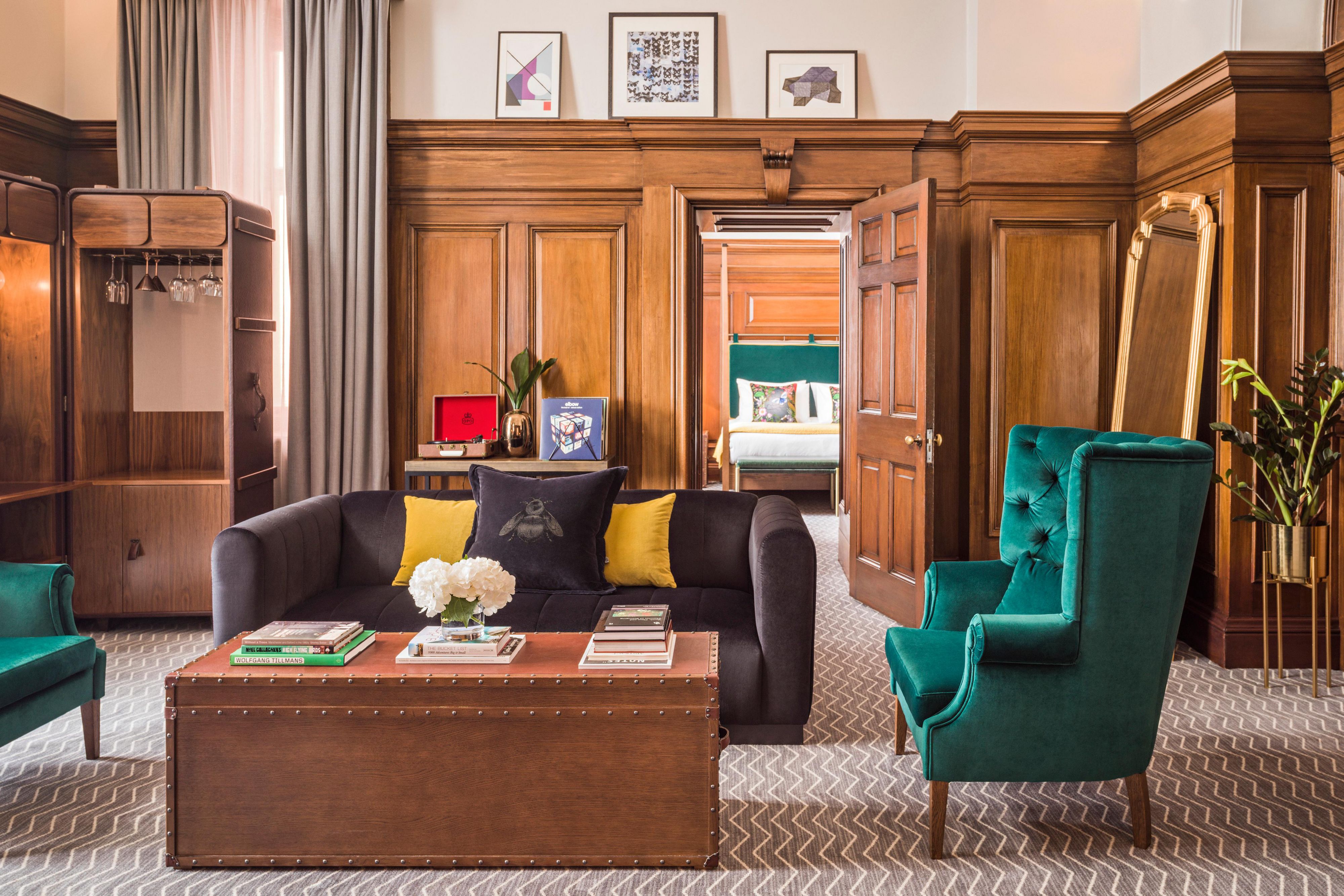 Lounge area with a coffee table and surrounding furniture in a 5-star hotel suite