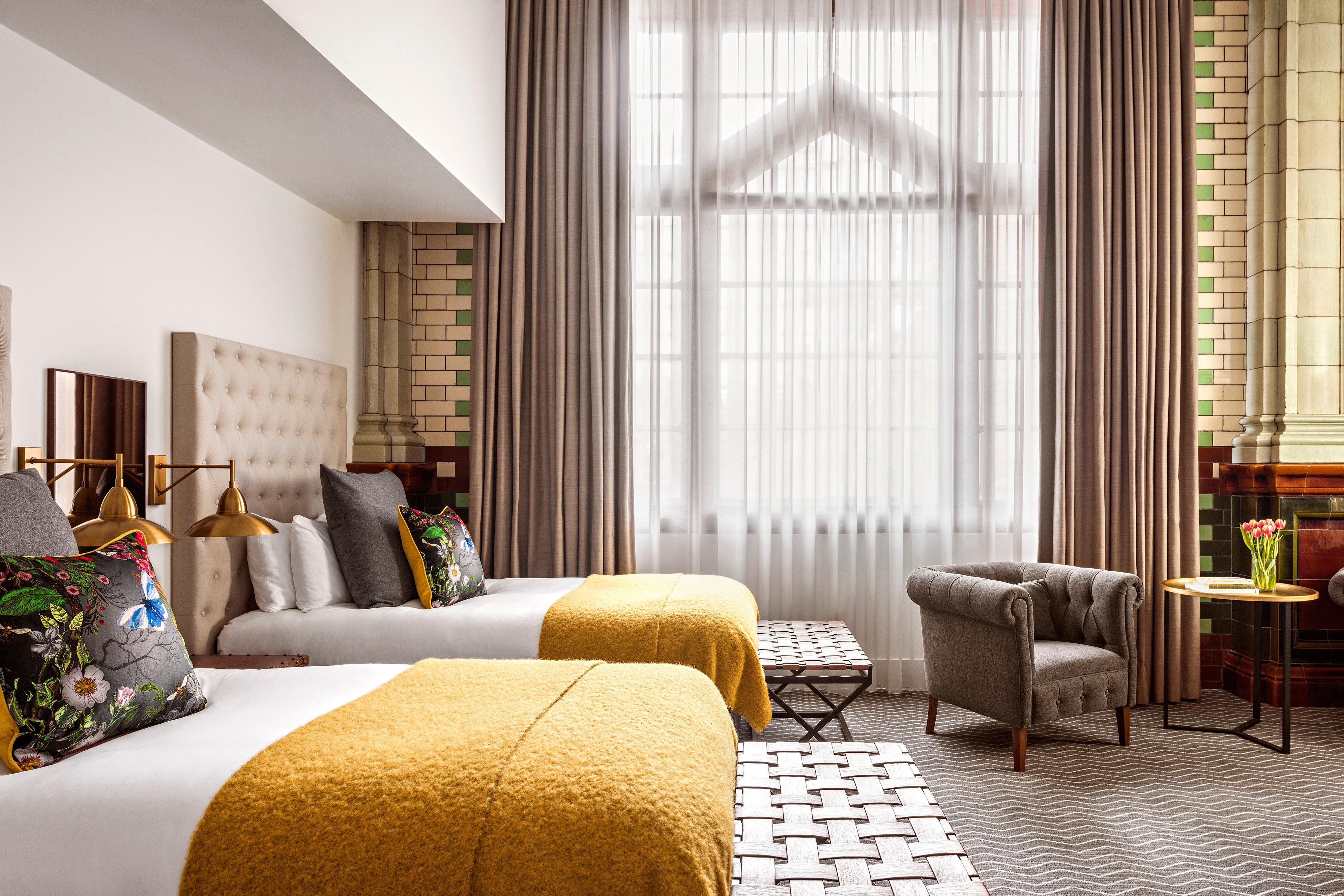 2 Double beds in a hotel guest room with a big window