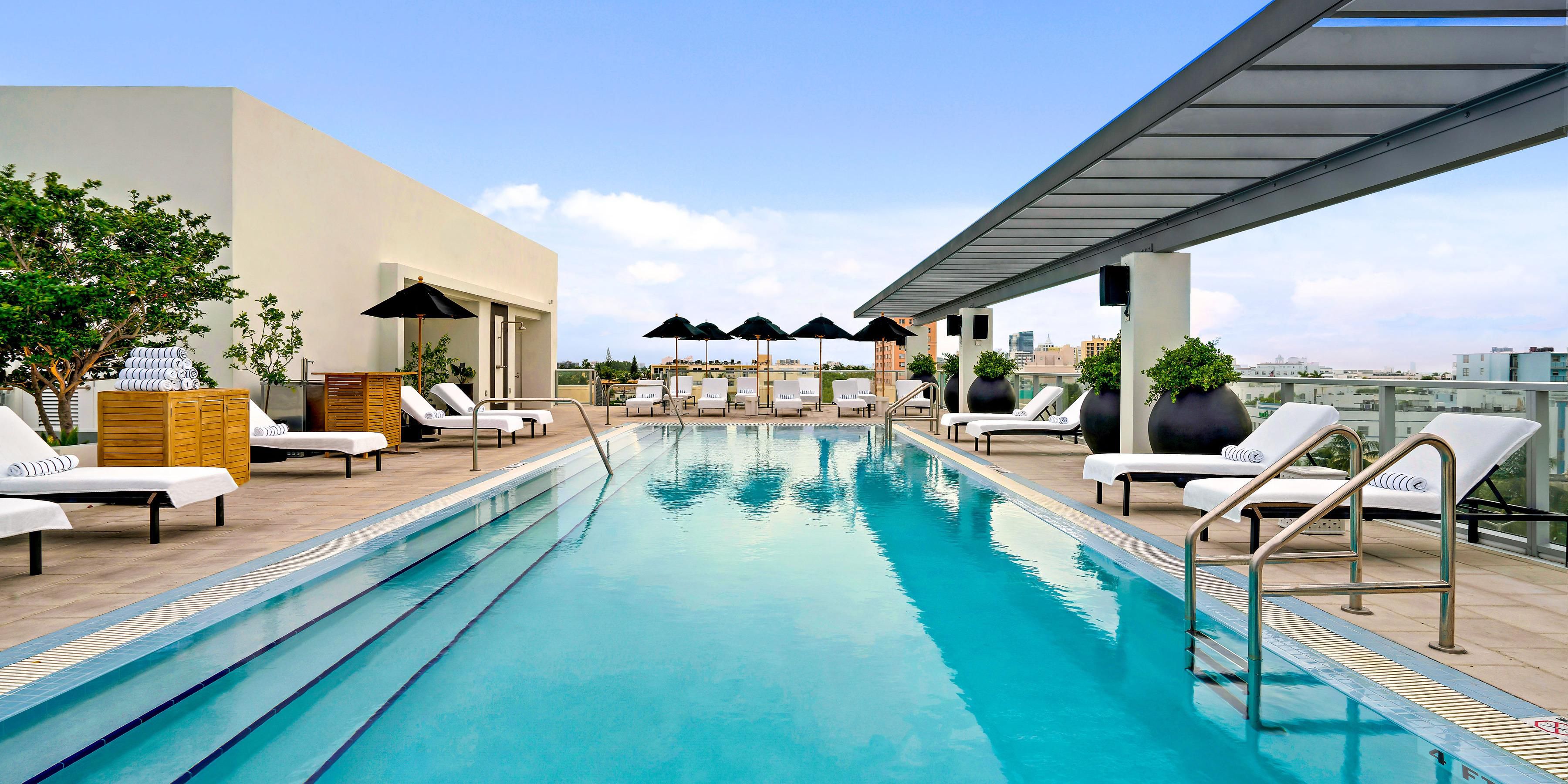 Poised atop our new five-story tower, with lounge chairs, sunning beds, palm trees — and that clear-blue Miami sky stretched out above you is our rooftop pool. Poolside spa services and hand-crafted cocktails are available at your whim while you soak up the Florida sun.