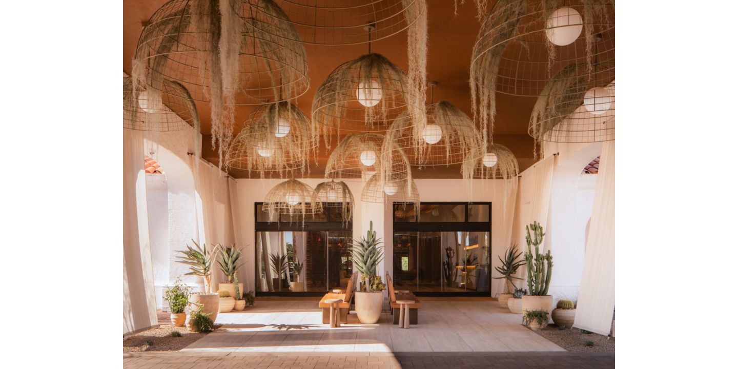 Rooftop pool with lounge chairs and umbrellas