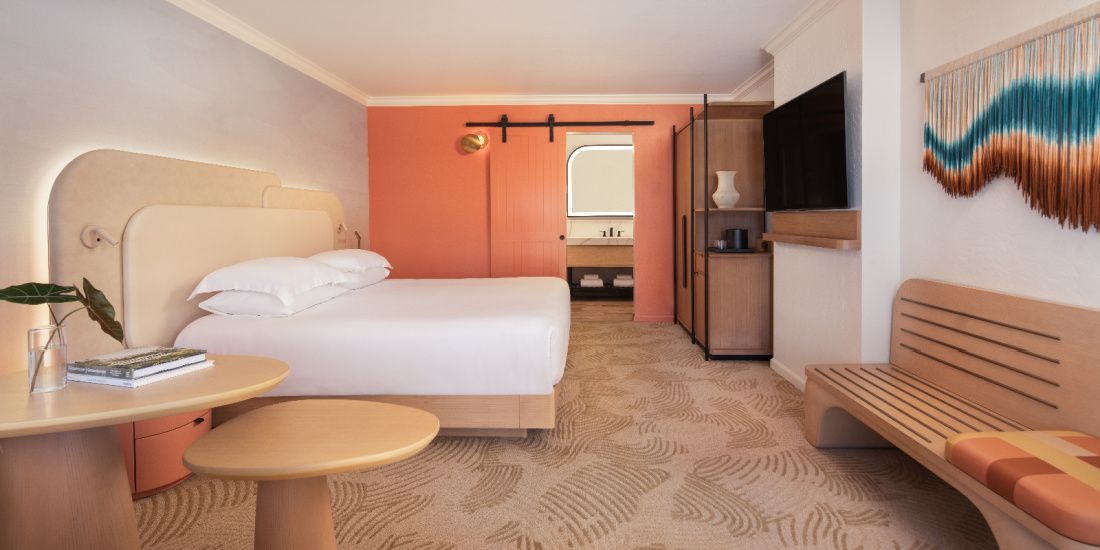 Guestroom decorated in desert colours at Kimpton MIrabel Resort &amp; Villas