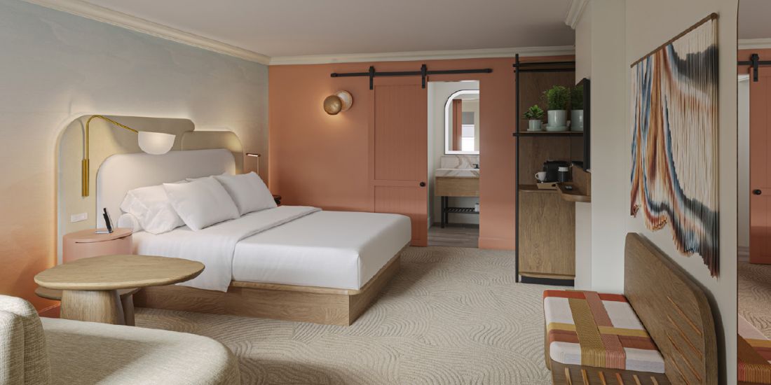 Guestroom decorated in desert colors at Kimpton MIrabel Hotel in Scottsdale