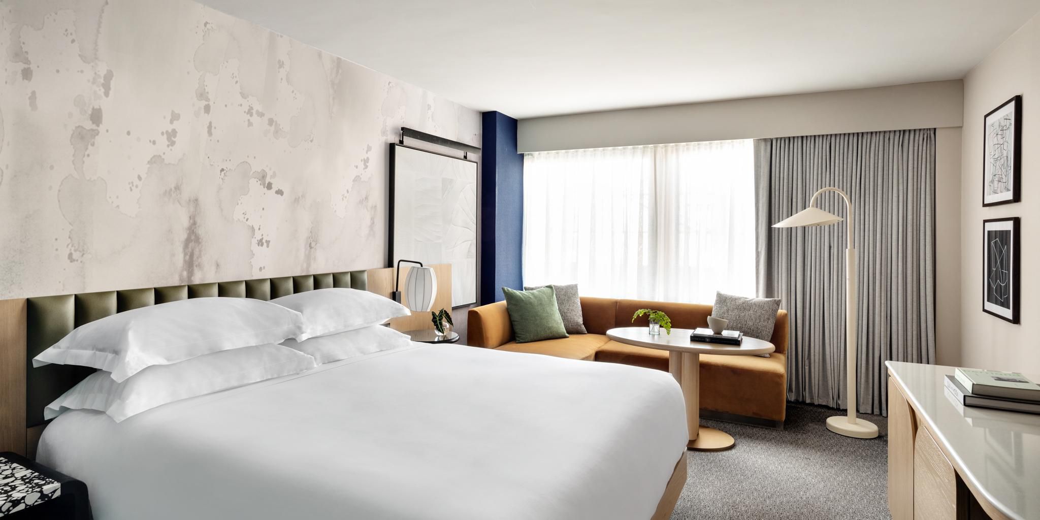 Spacious king room with sofa and modern decor