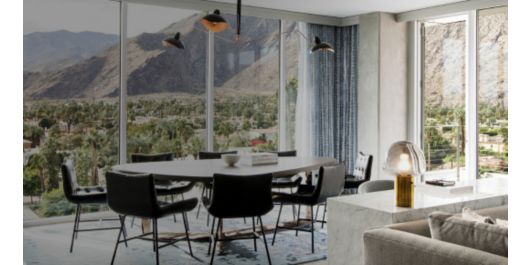 suite with floor to ceiling windows overlooking the mountain range in palm springs