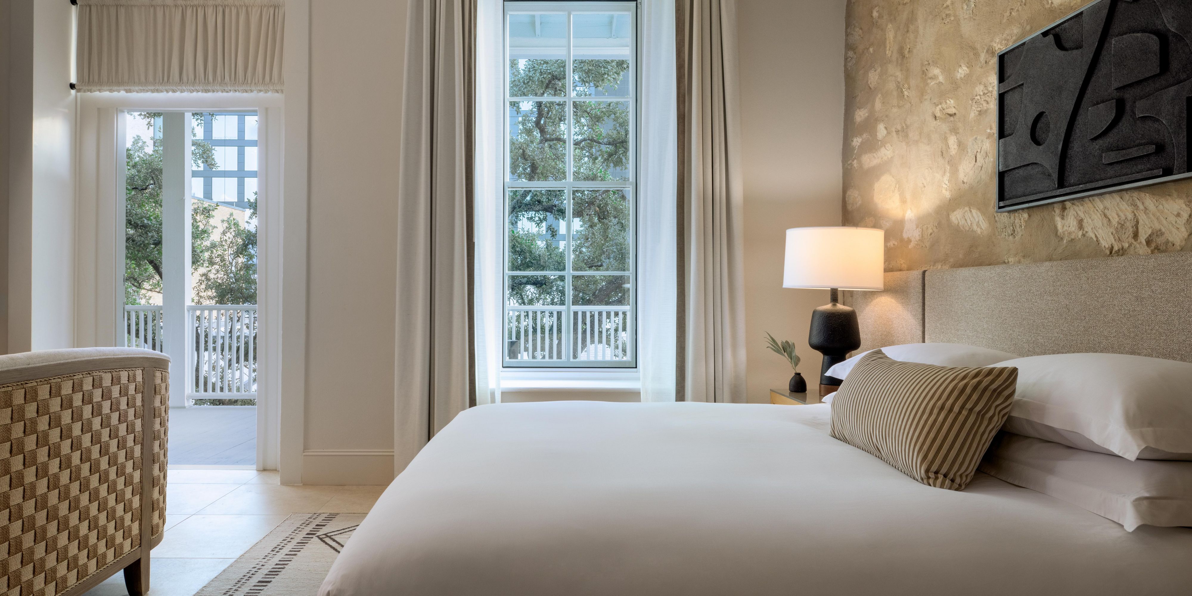 Tucked inside our 19th-century renovated schoolhouse that overlooks a historic courtyard with century-old live oaks, eight distinctive guest suites with stone-clad walls, exposed brick, kitchenettes, free-standing tubs, and semi-private patios offer a luxurious, character-filled connection to the past.