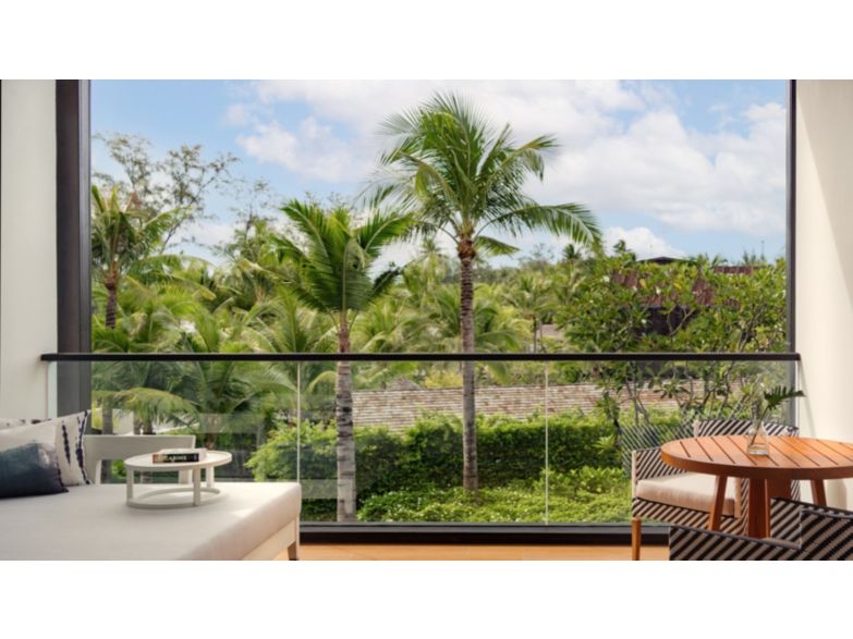 island trees and shrubbery surrounds mallorca building