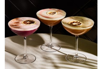 silver plate of baked oysters with glass of white wine