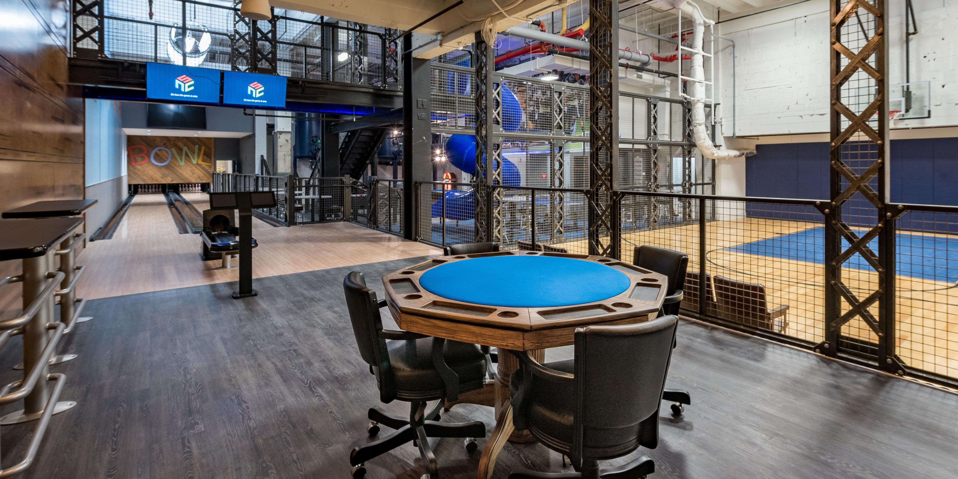 At Kimpton Cardinal Hotel’s Rec Room, you can drop pins, shoot hoops, rack ‘em up, shuffle some boards and watch whatever you want on a ginormous 80-inch flat screen. Drop in some foosball, ping-pong and card gaming tables to up the ante on the whole experience. Add a half-dozen more TVs. Now put a 2-story spiral slide in the middle of it.
