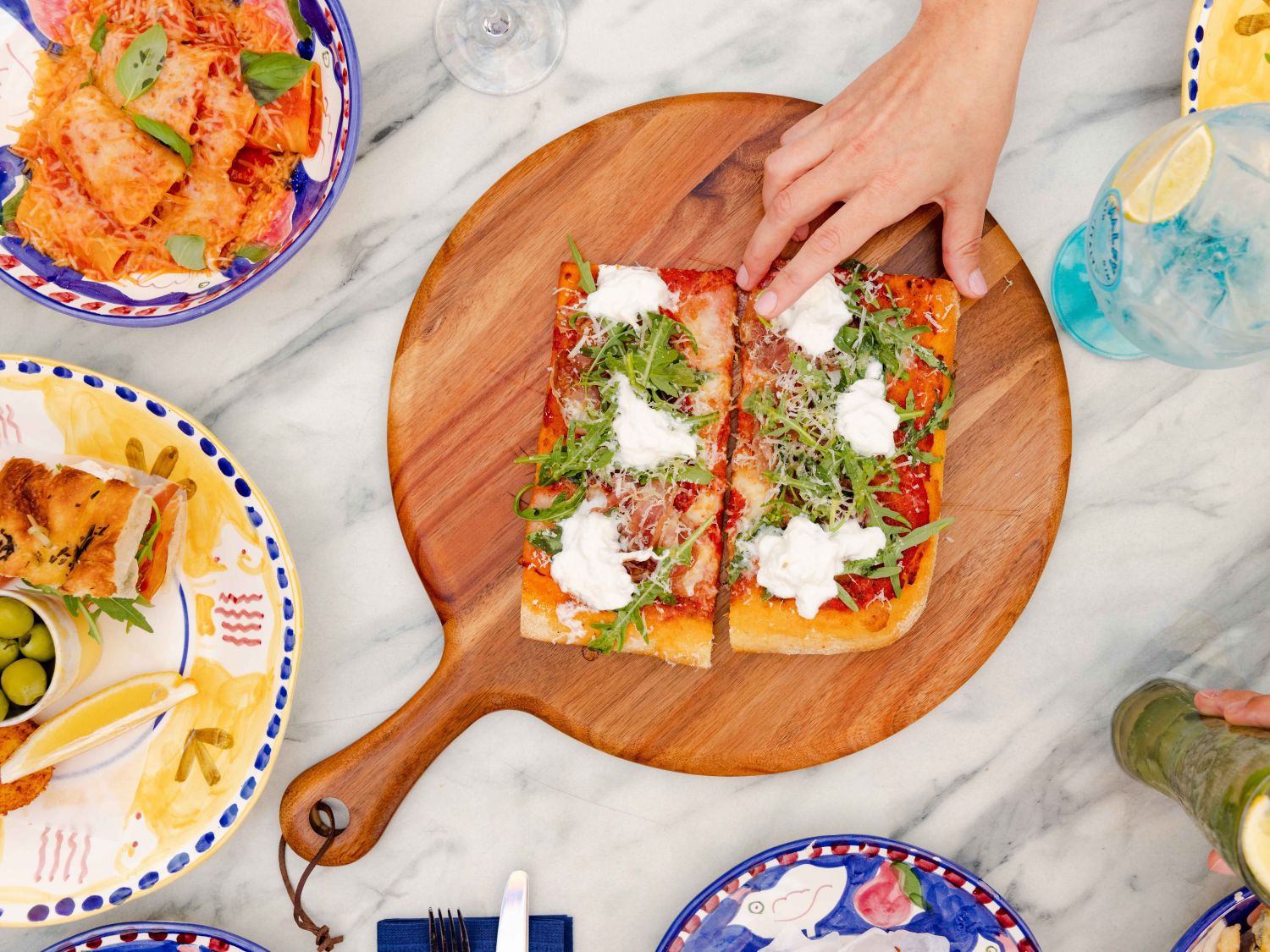 Terrace dining featuring pizza and cocktails