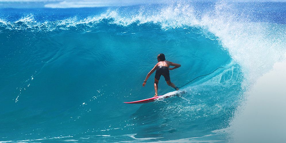 Boy surfing in the ocean