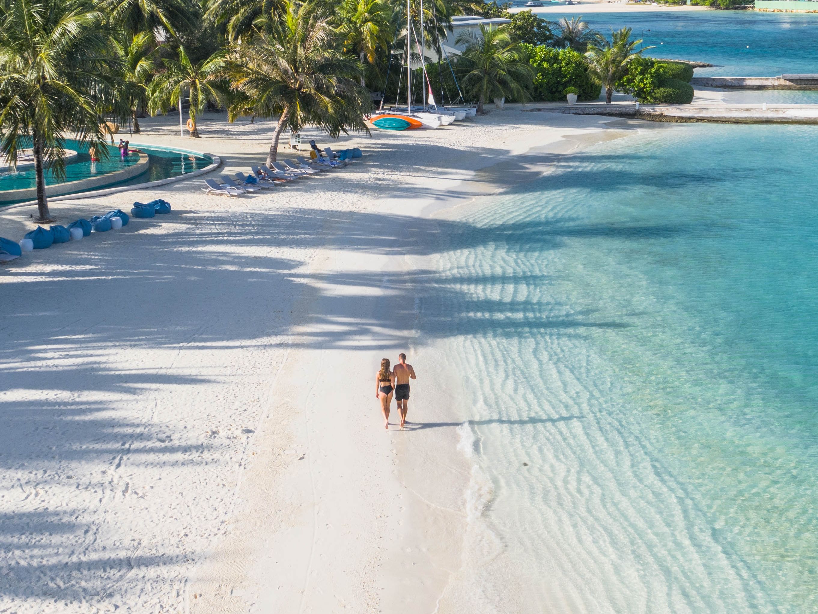 Couple walking along the beach