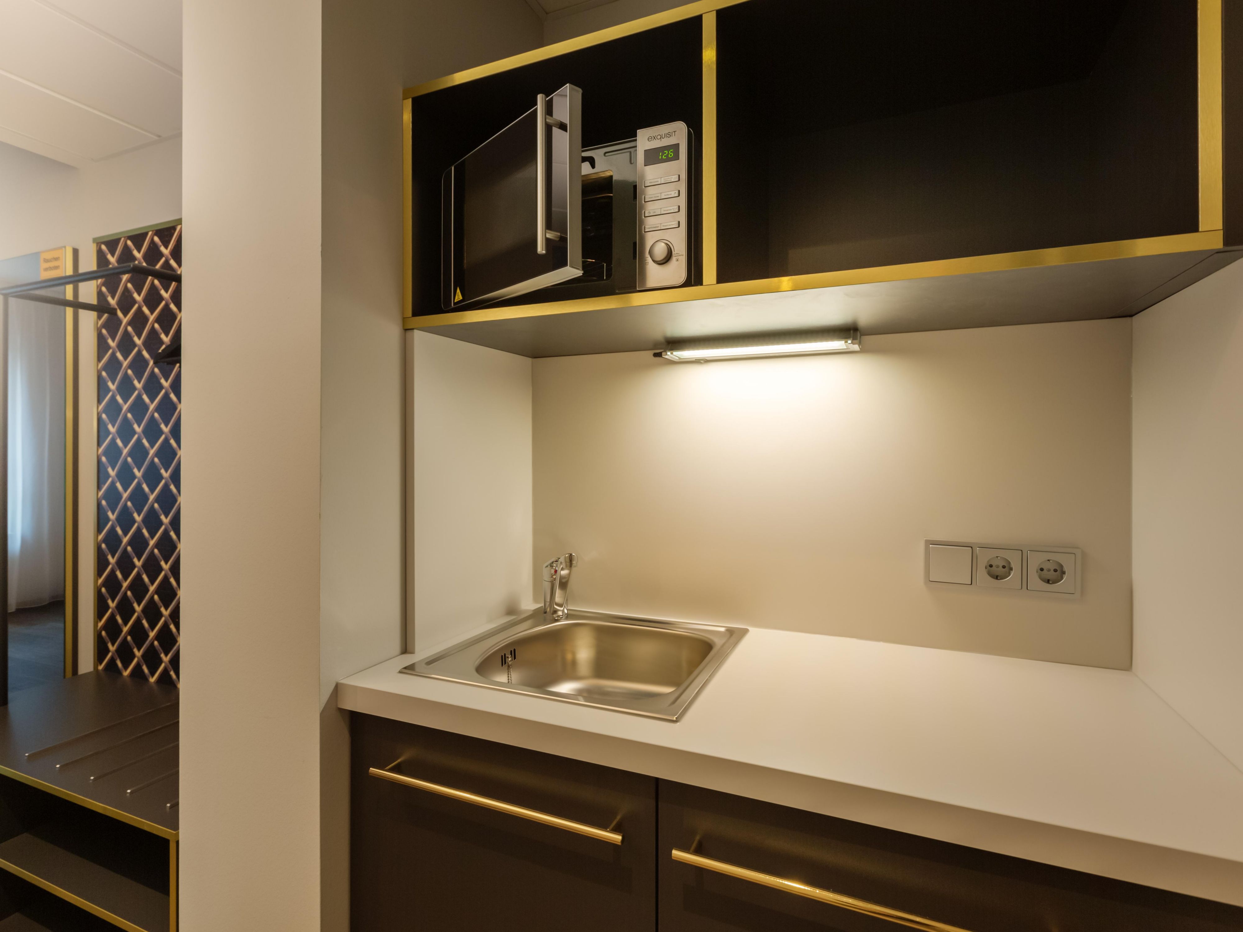 Experience the ultimate in convenience and comfort with our thoughtfully designed rooms, each featuring a convenient kitchenette equipped with a microwave, kettle, coffee machine and fridge. Whether you're preparing a quick snack or storing your favorite beverages, we've got you covered. Need dishes? Just ask at reception!
