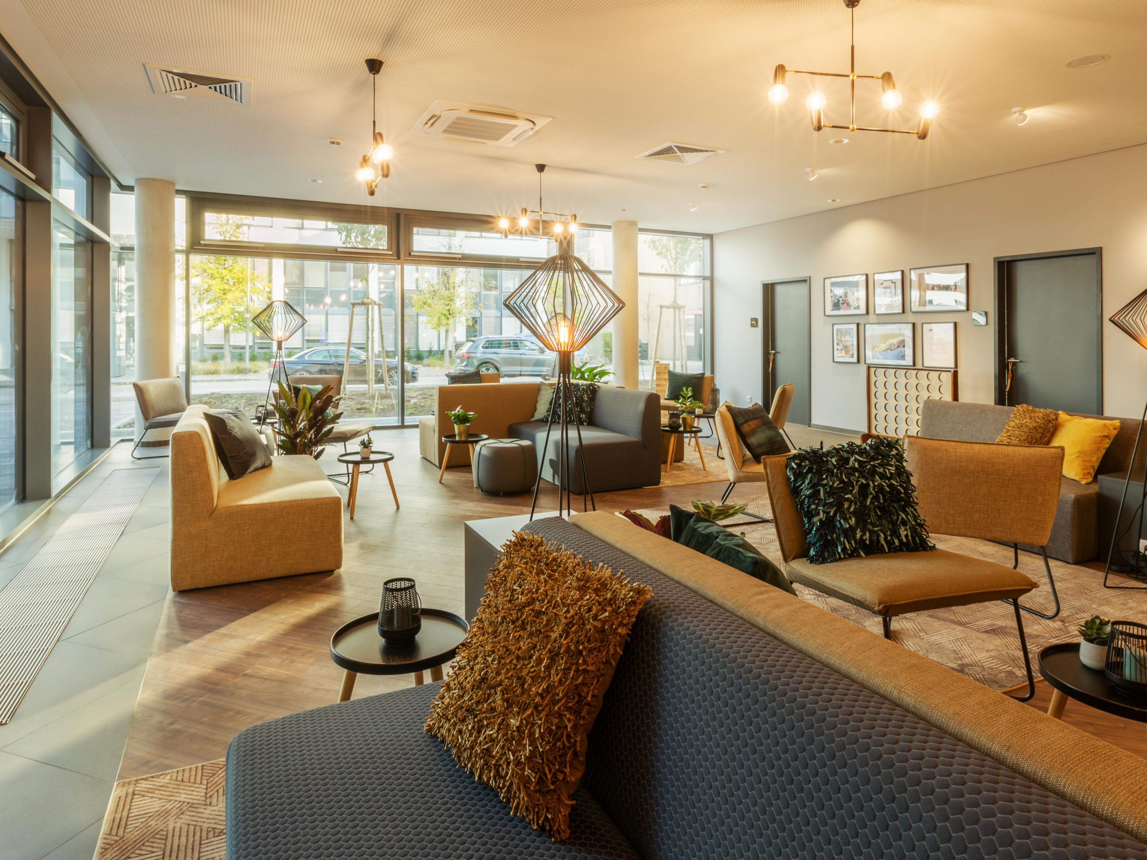 Our Stuttgart hotel with parking provides not only comfortable rooms but also a range of amenities to ensure a pleasant stay. Enjoy free high-speed Wi-Fi, 24-hour reception, a cosy Living Lobby for work or relaxation, and off-site fitness facilities. Secure outdoor parking is available for €20 per night, exclusively for registered guests.