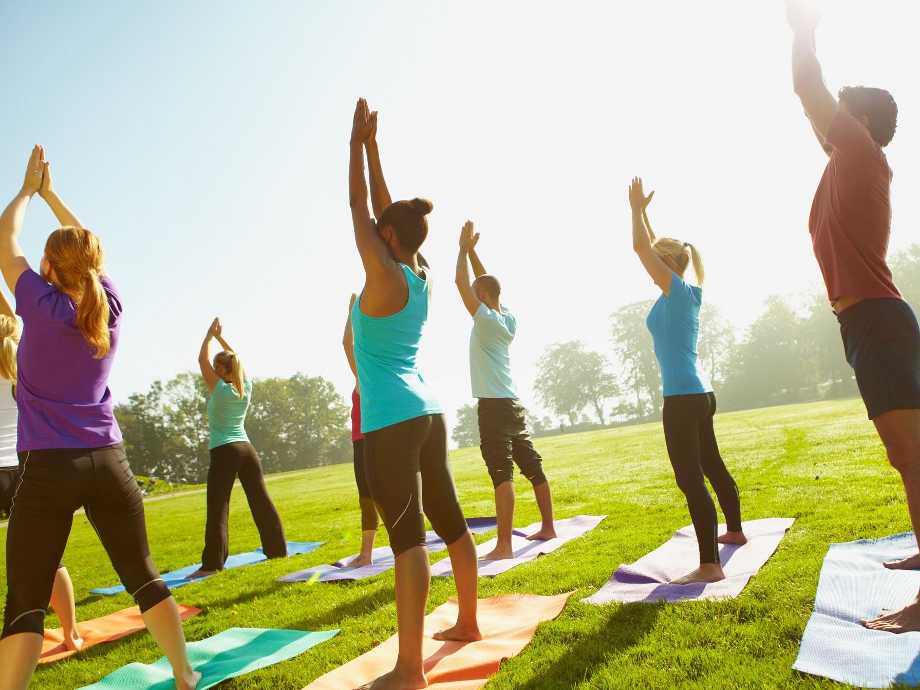 Group doing yoga outdoors