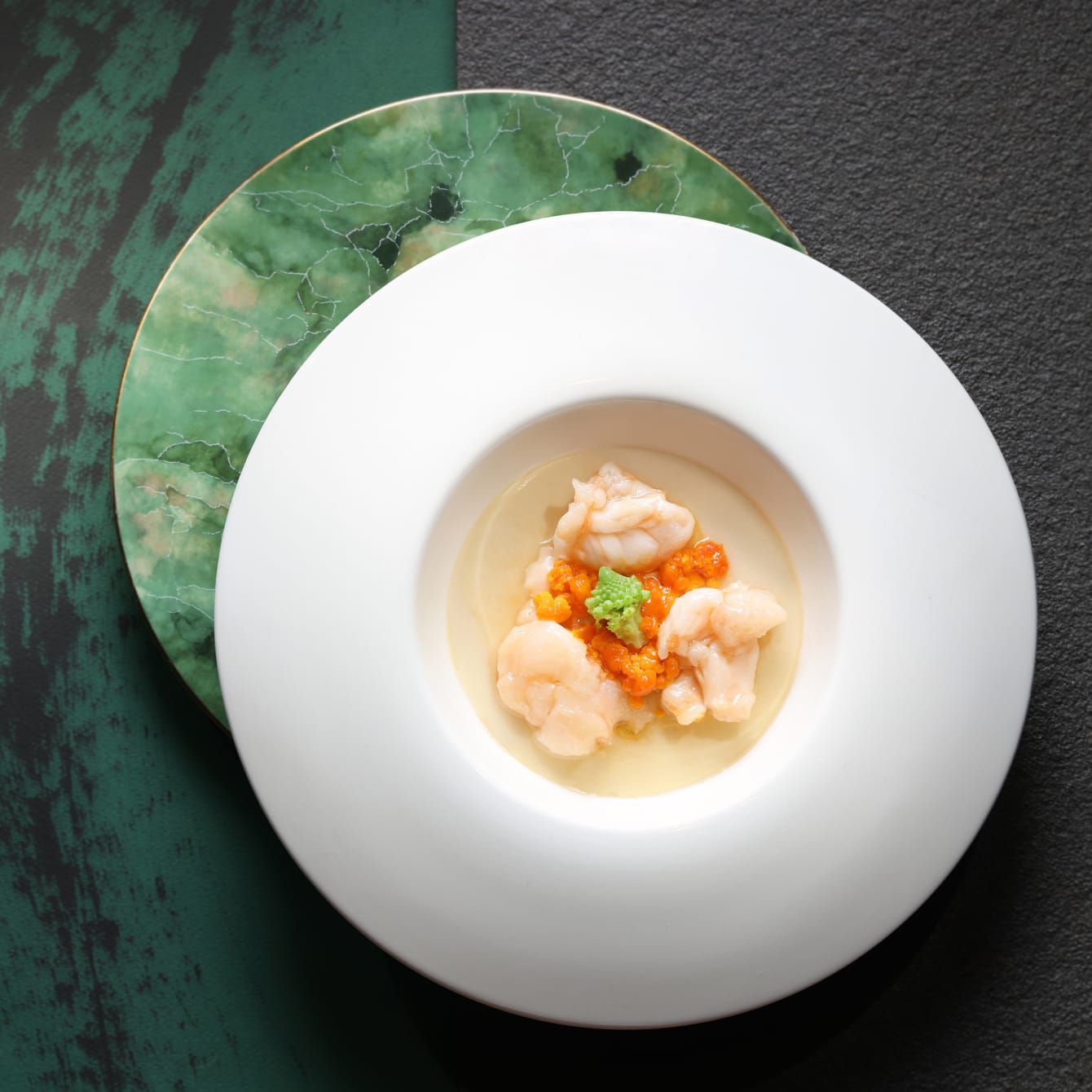 A masterfully composed dish of elegantly plated seafood.