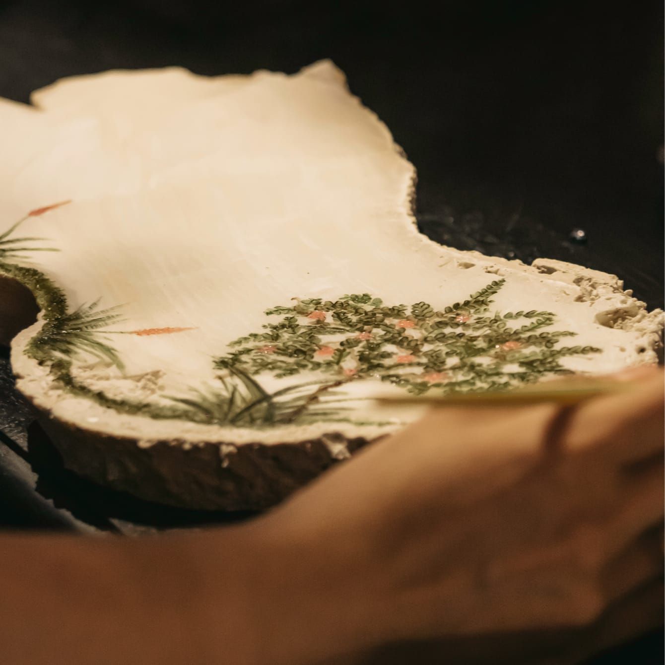 A giant seafood shell with delicate garnishes.