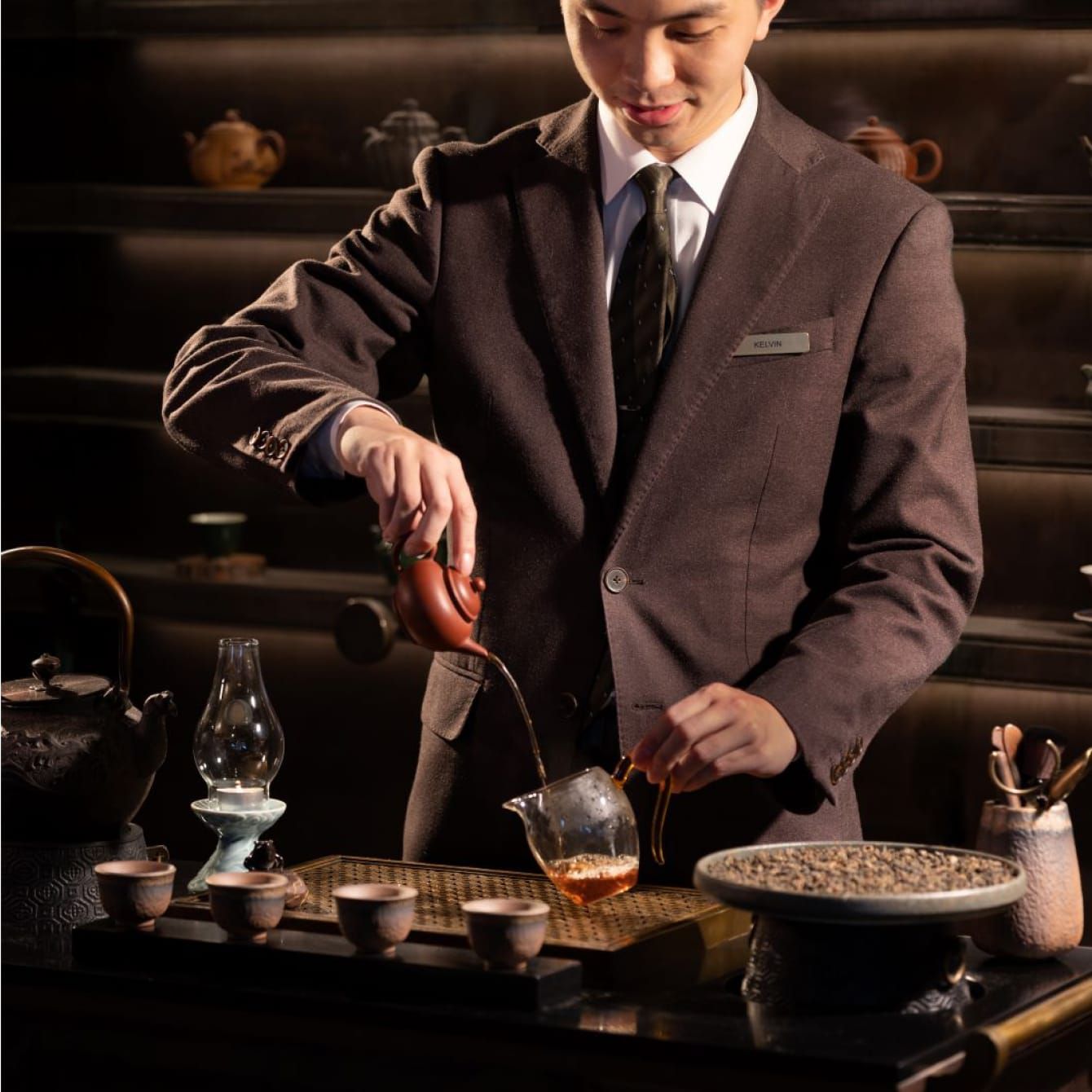 A expert tea sommelier preparing a tea ceremony.