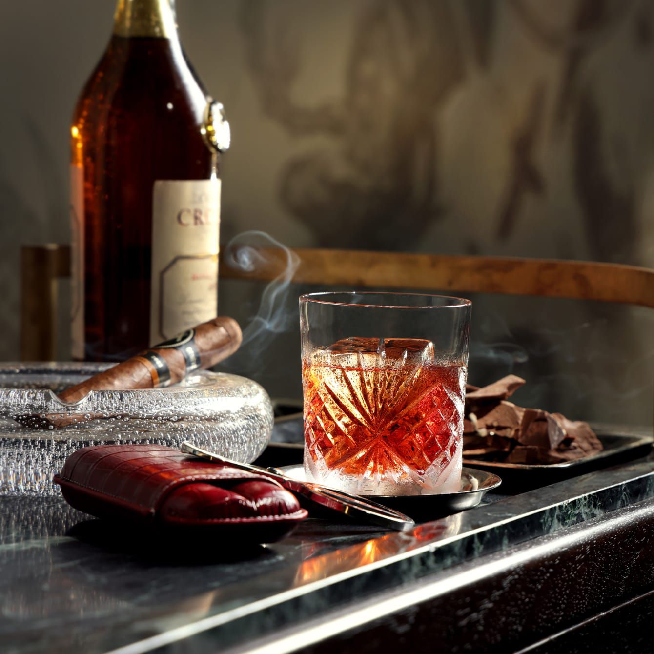 A vintage bottle of whiskey and cigar in an intimate moment in Hong Kong.