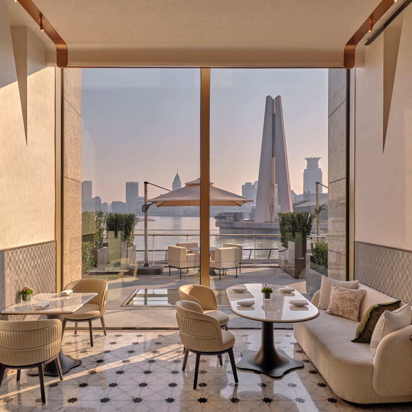 A stunning morning view across a river towards a city skyline.