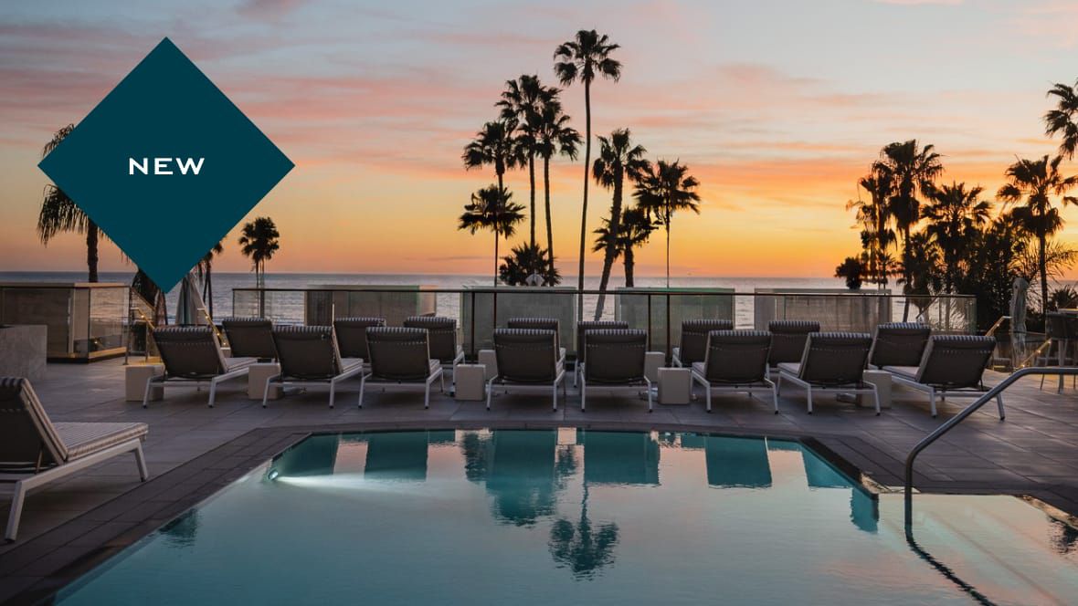 The new hotel Regent Santa Monica Beach's pool deck overlooking the ocean at sunset