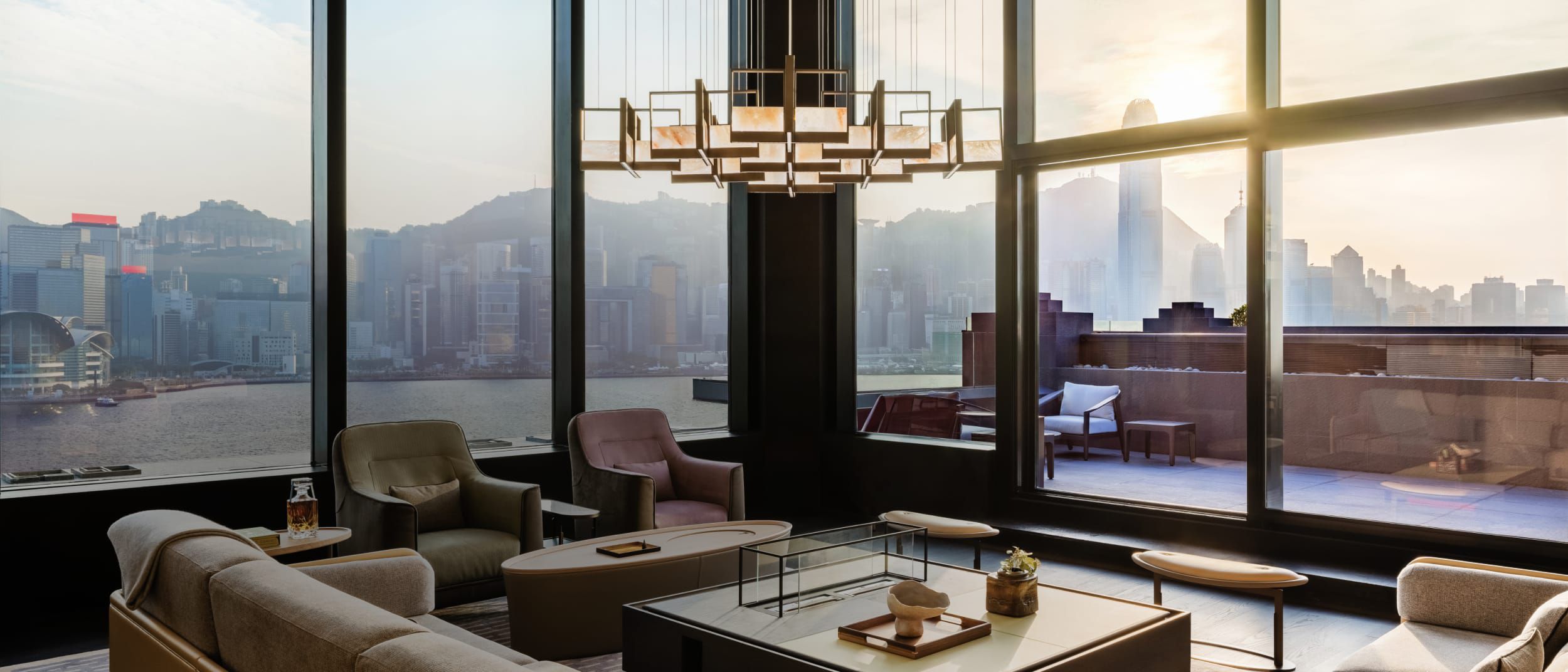 Luxurious Hong Kong suite with harbor and skyline views.