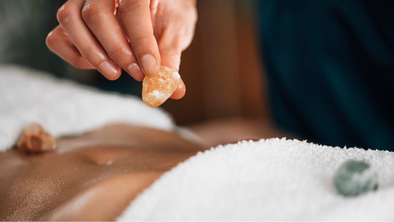 A healing massage that includes crystals for improved mood and relaxation.