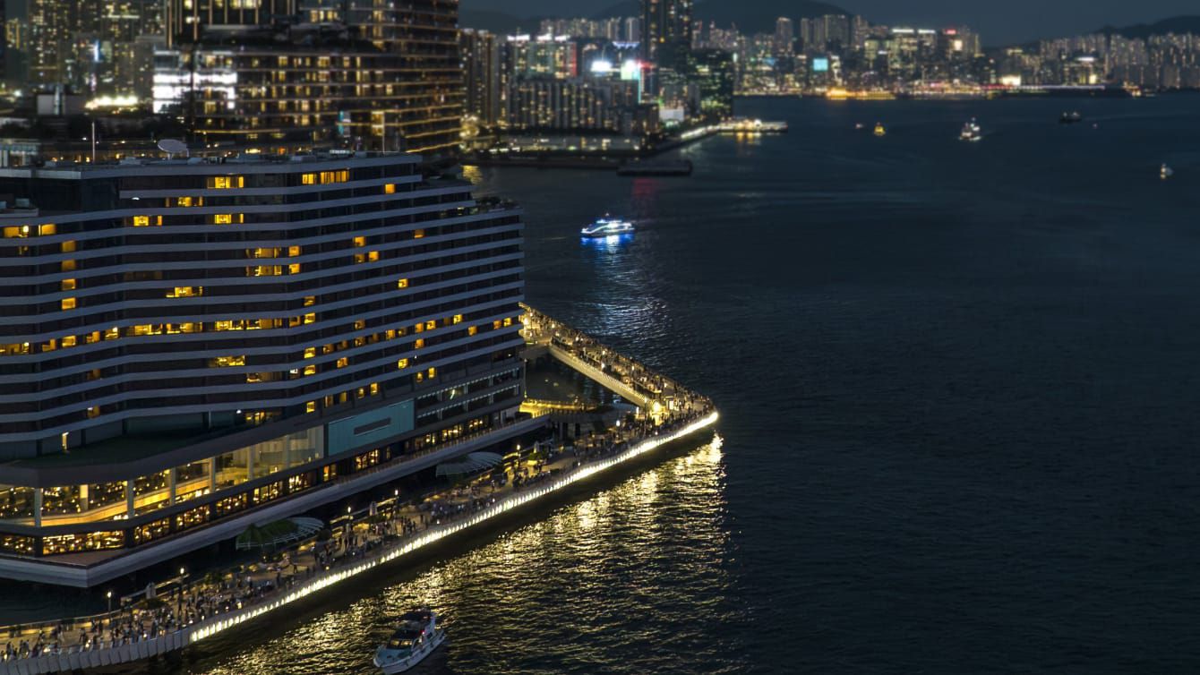Night-time scene of hotel with lights glittering on the water