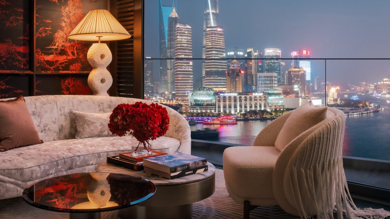 Opulent guest sitting room overlooking city skyline