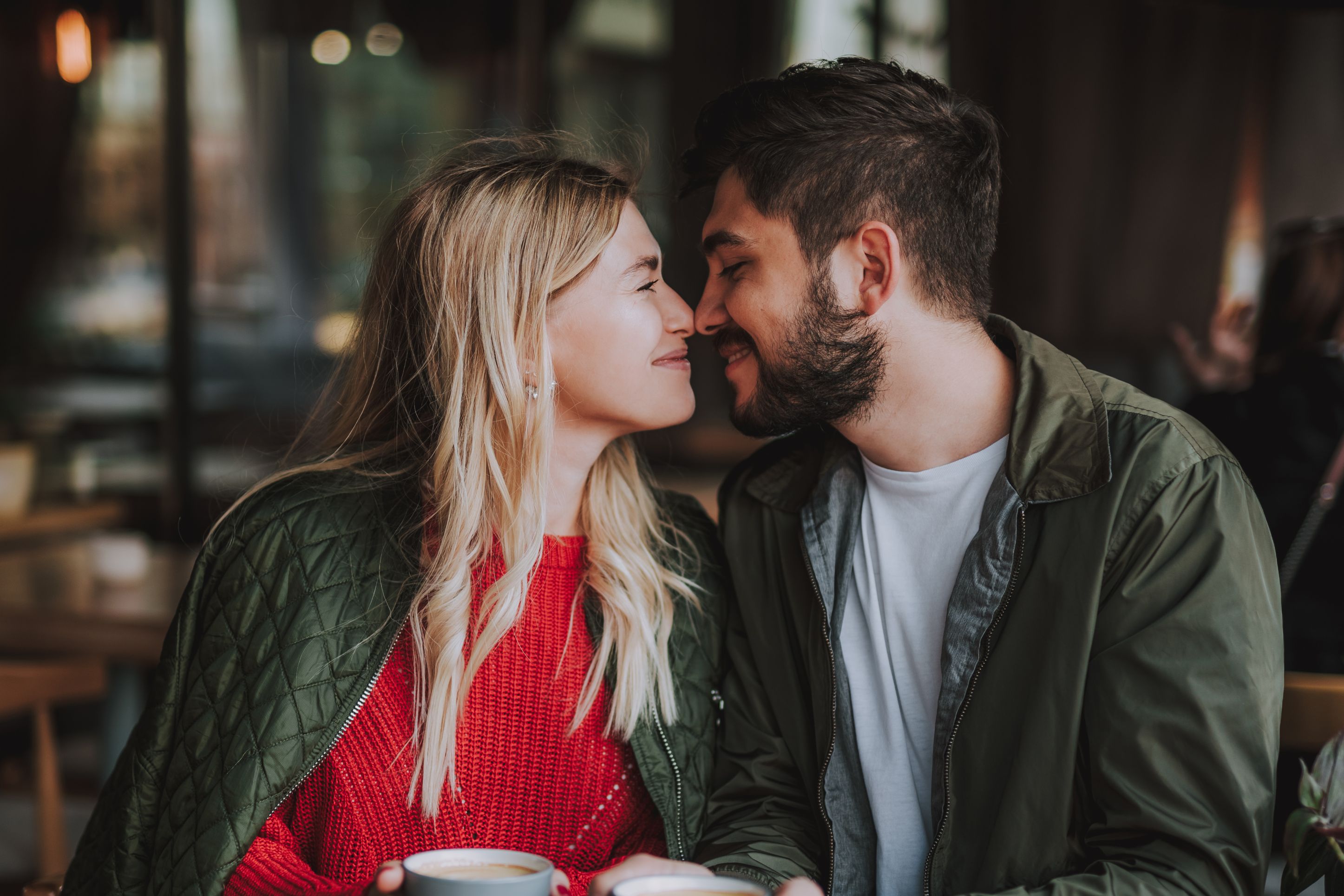 Couple looking into each other's eyes at the table.